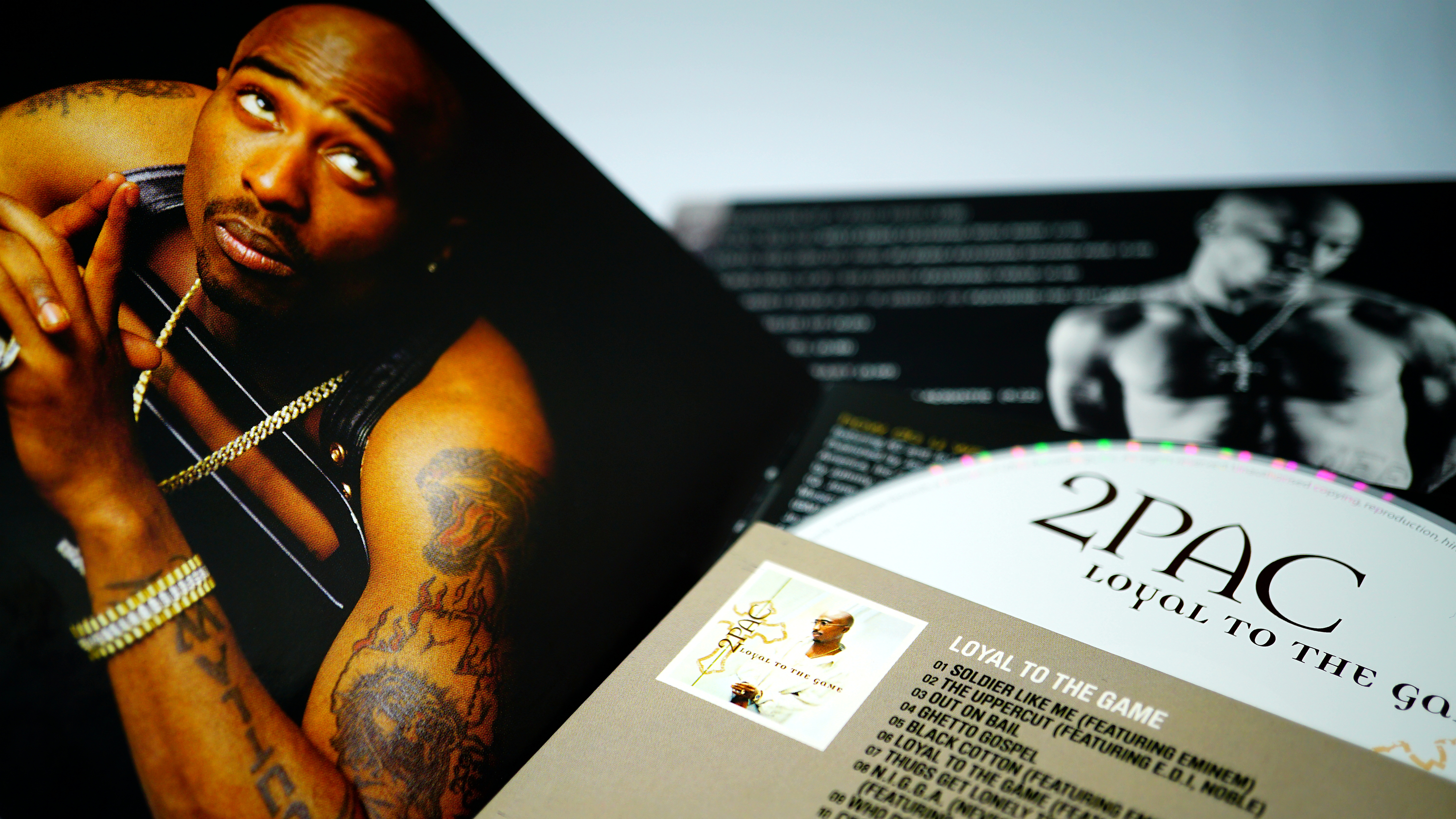 Collection of covers and CD inserts of the late Tupac Shakur.