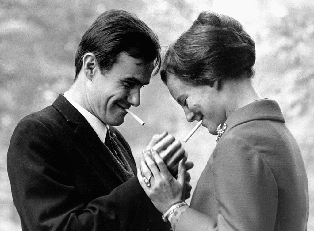 Crown-princess Margrethe and Henri de Monpezat lighting a cigarette in 1966.