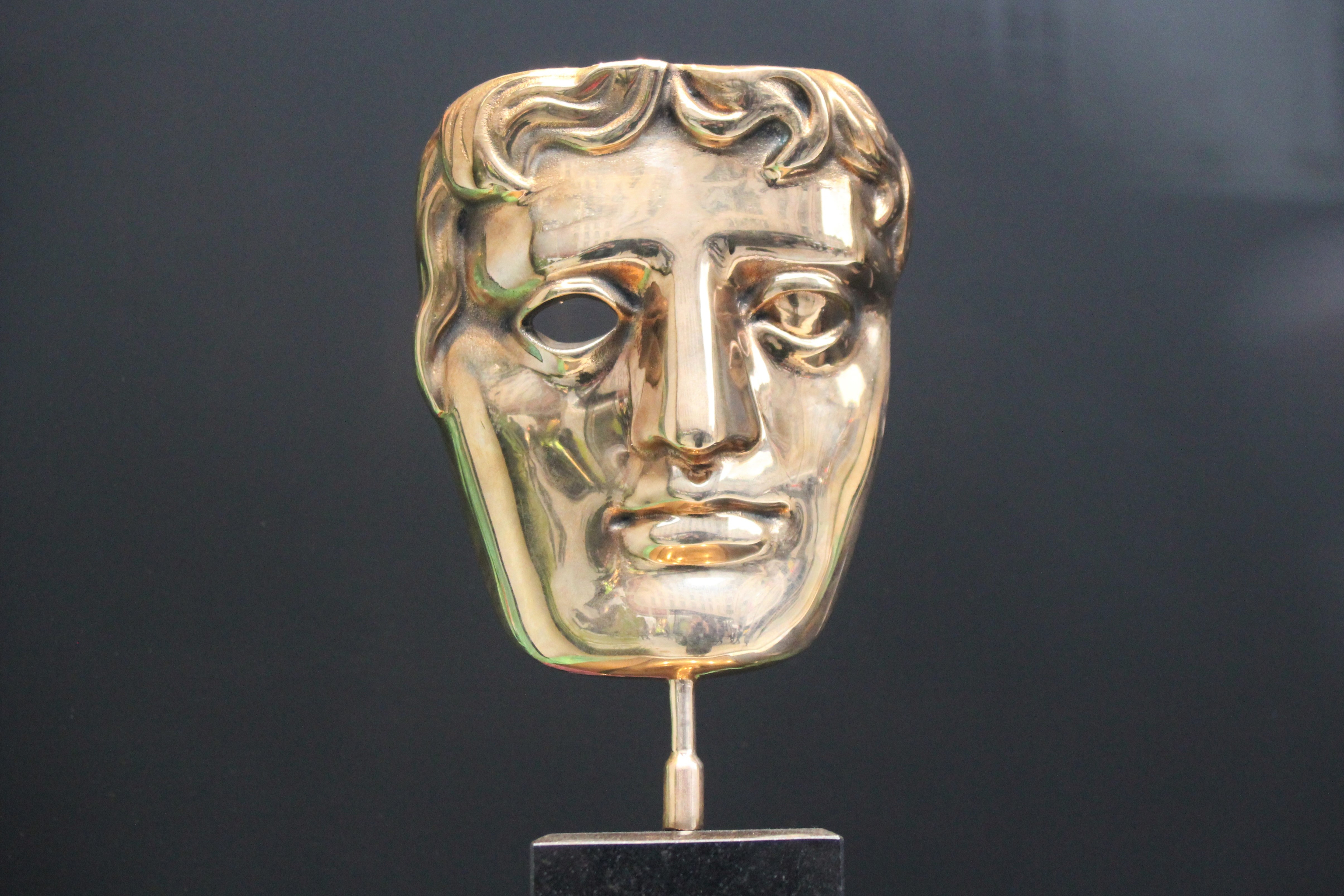 BAFTA (British Academy Film and Television Awards) award statue trophy.