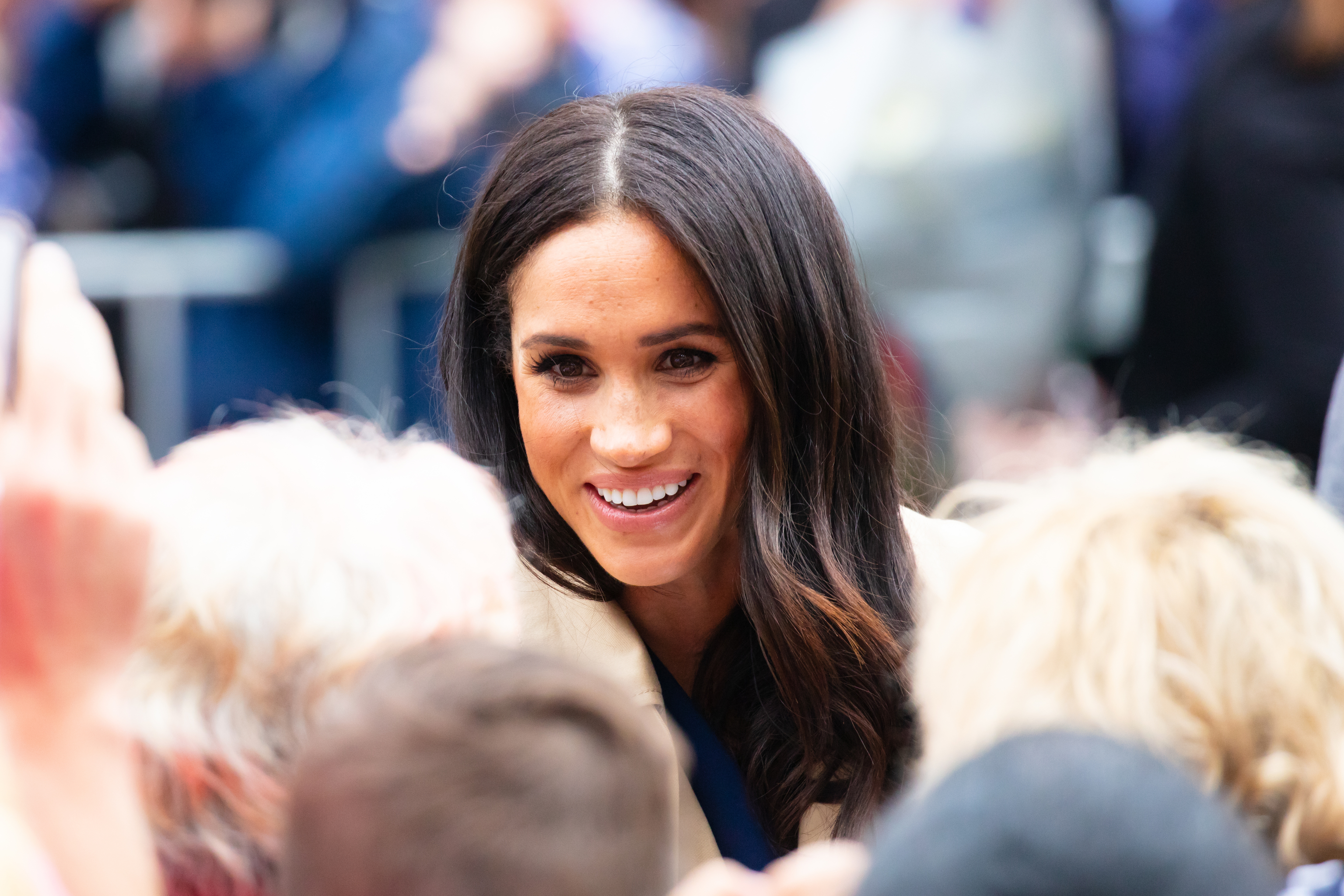 Meghan Markle greets fans outside Government House in Melbourne, Aus.