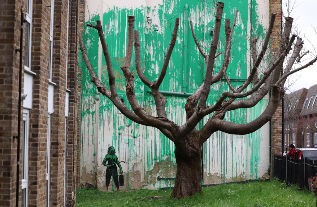 A Banksy new mural near a tree in the Finsbury Park area of London