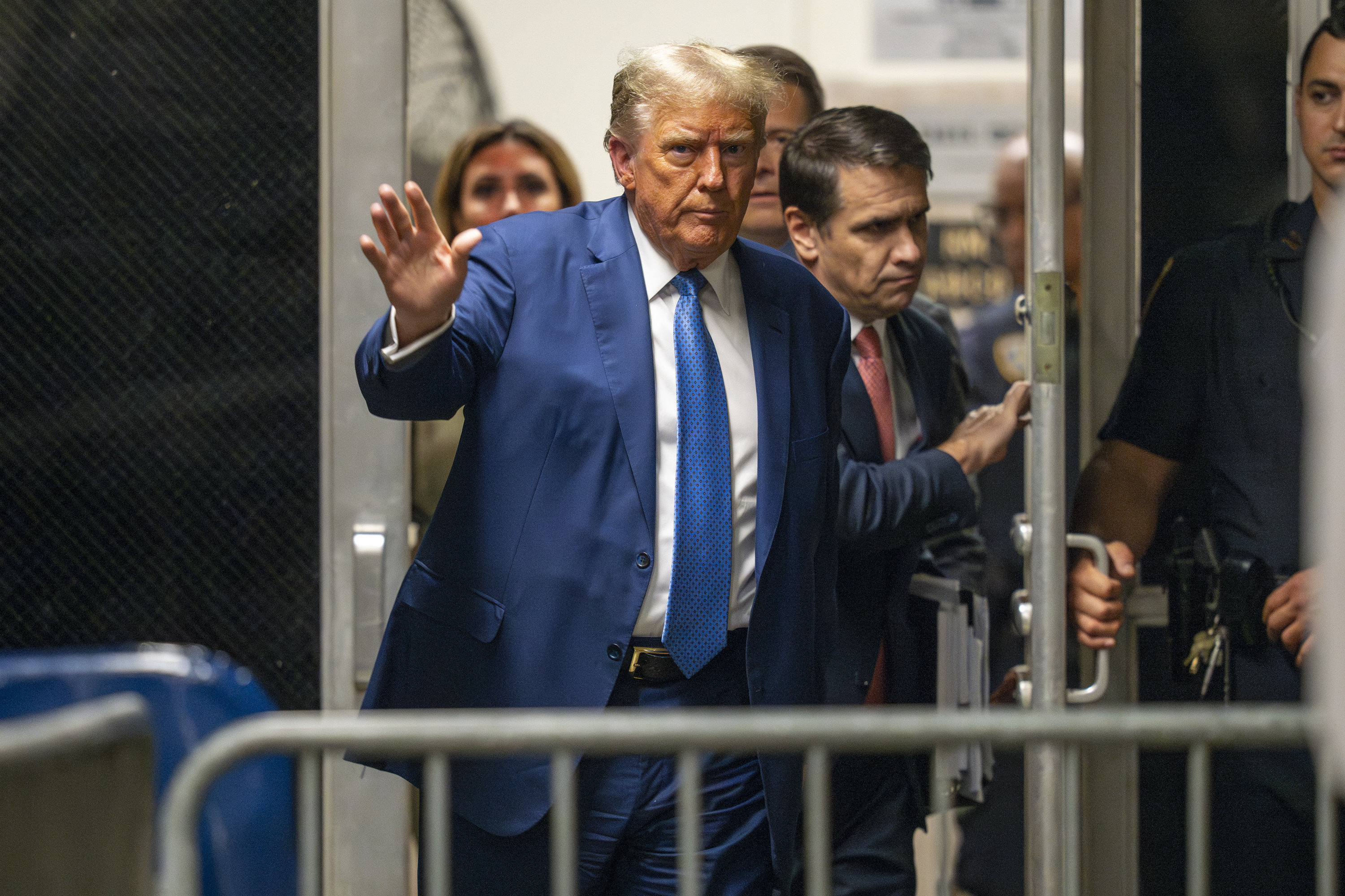 Former President Donald Trump returns from lunch to his trial at the Manhattan Criminal court.