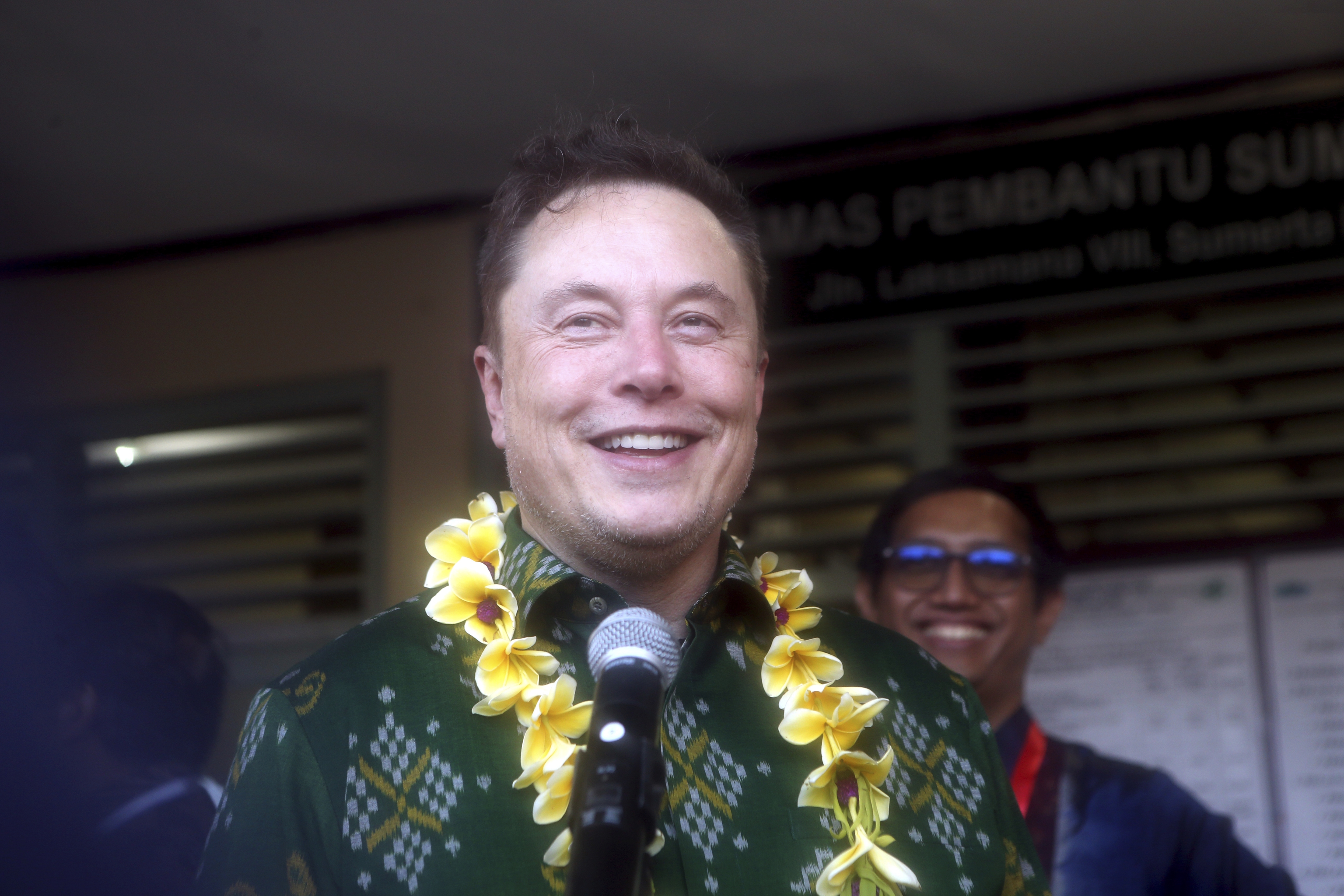 Elon Musk talks to press media during the launch of Starlink satellite internet service at a public health center in Bali, Indonesia.