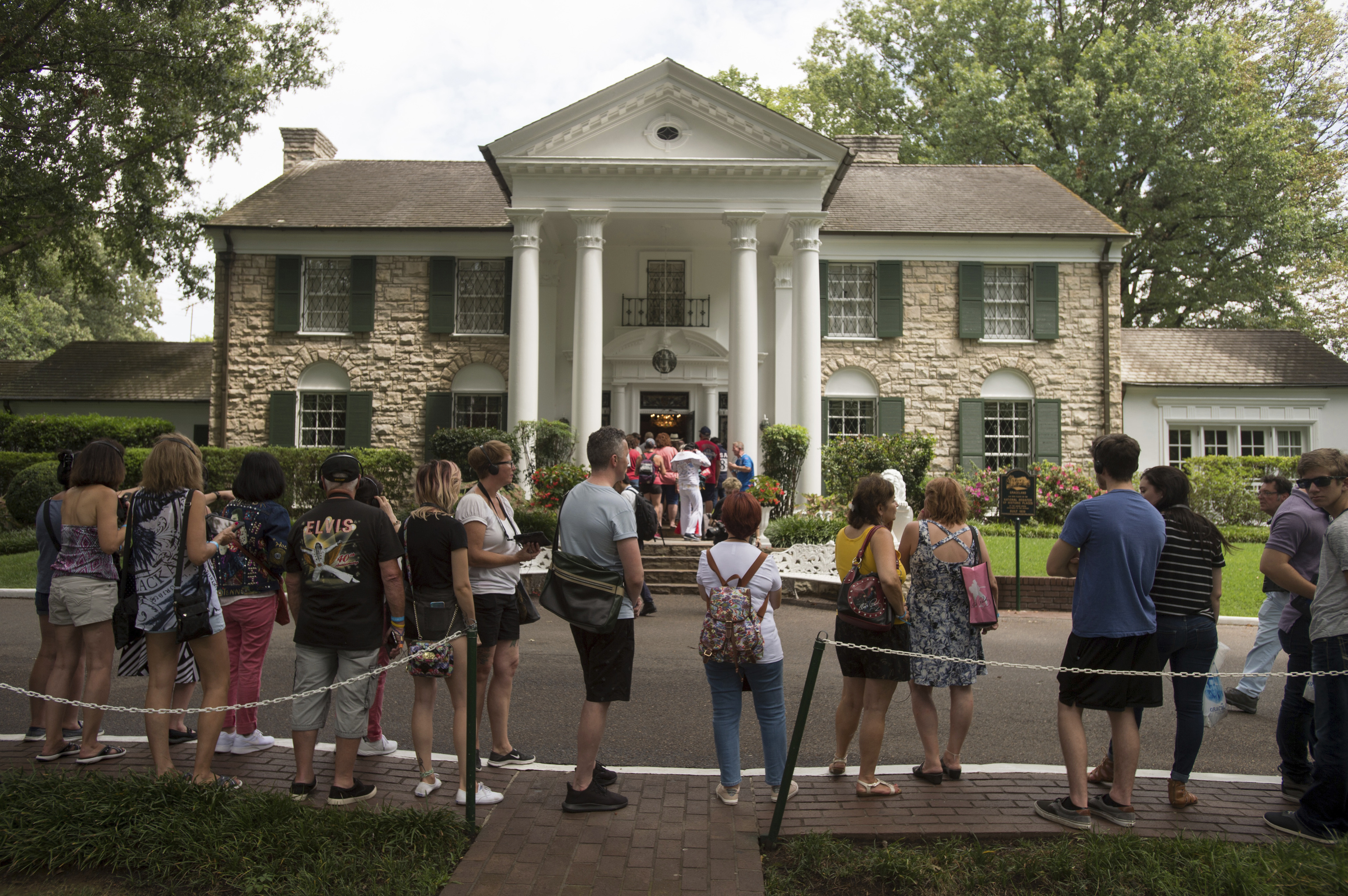 Fans wait in line outside Graceland.