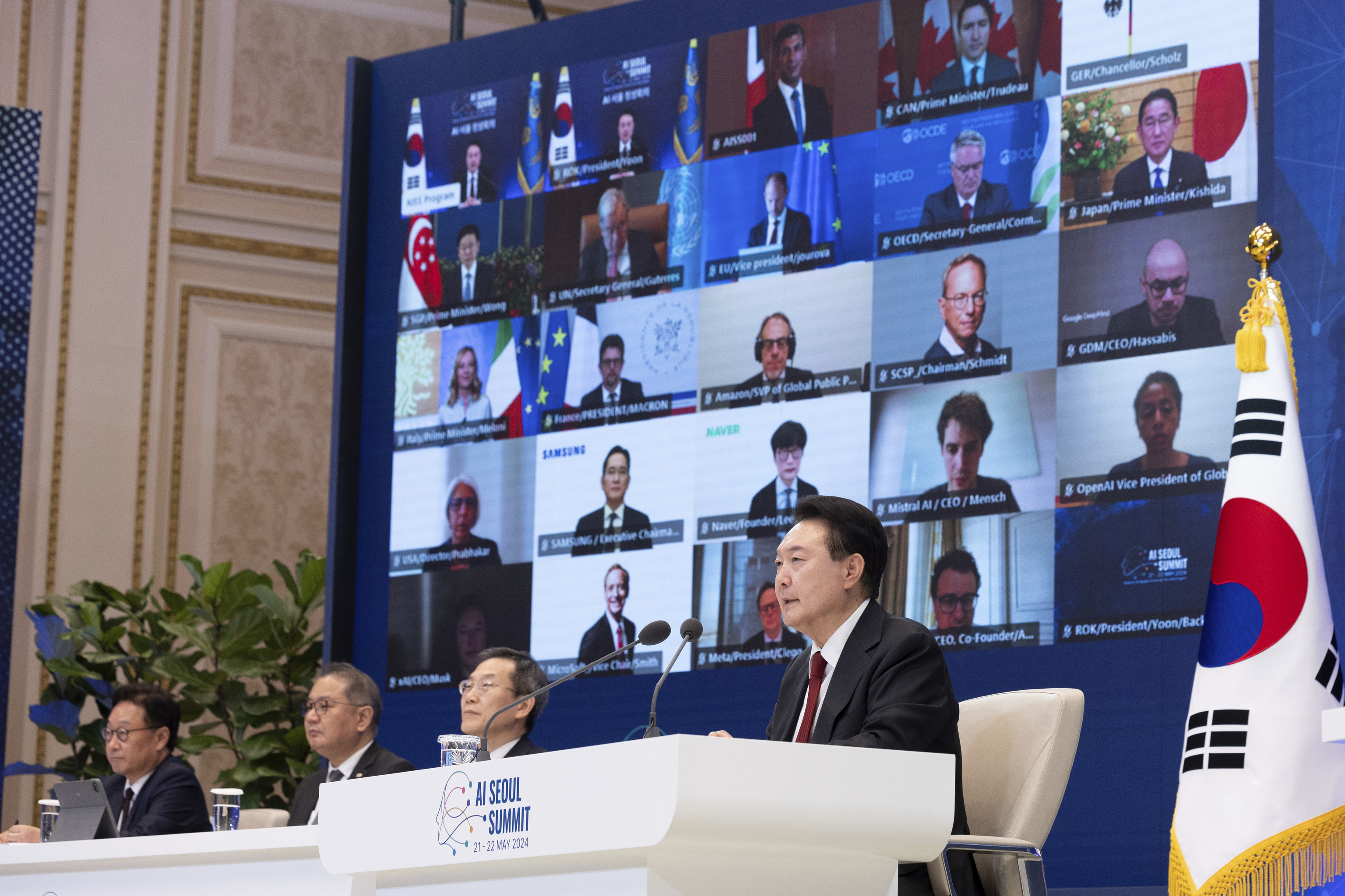 South Korean President Yoon Suk Yeol, right, speaks during the virtual AI Seoul Summit