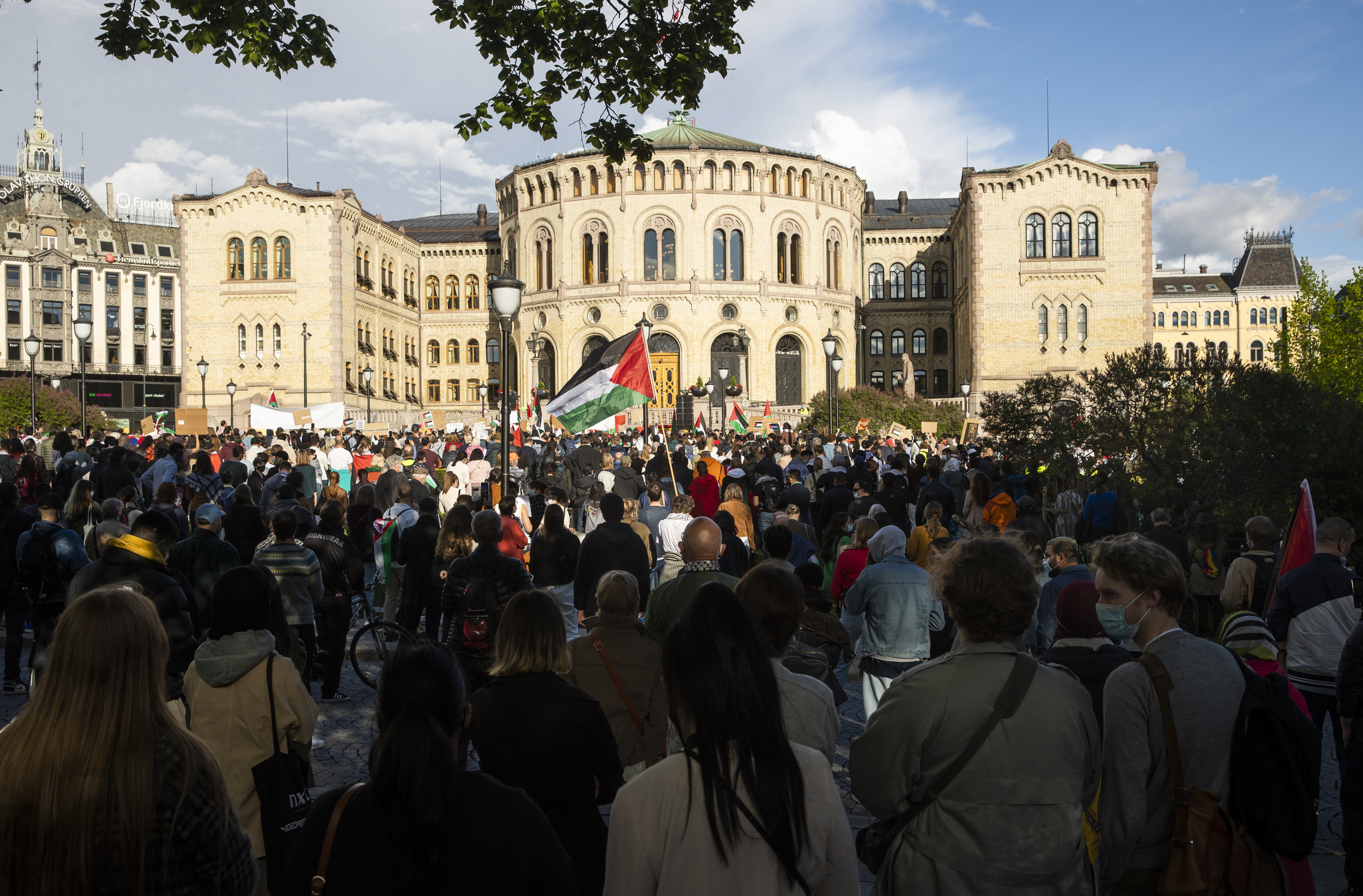 People gather in support of the Palestinain people in front of the parliament building in Oslo.