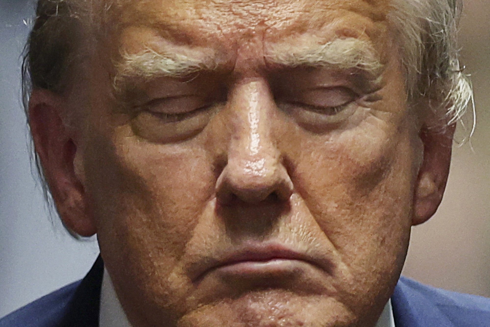 ormer President Donald Trump closes his eyes during his trial at Manhattan criminal court.