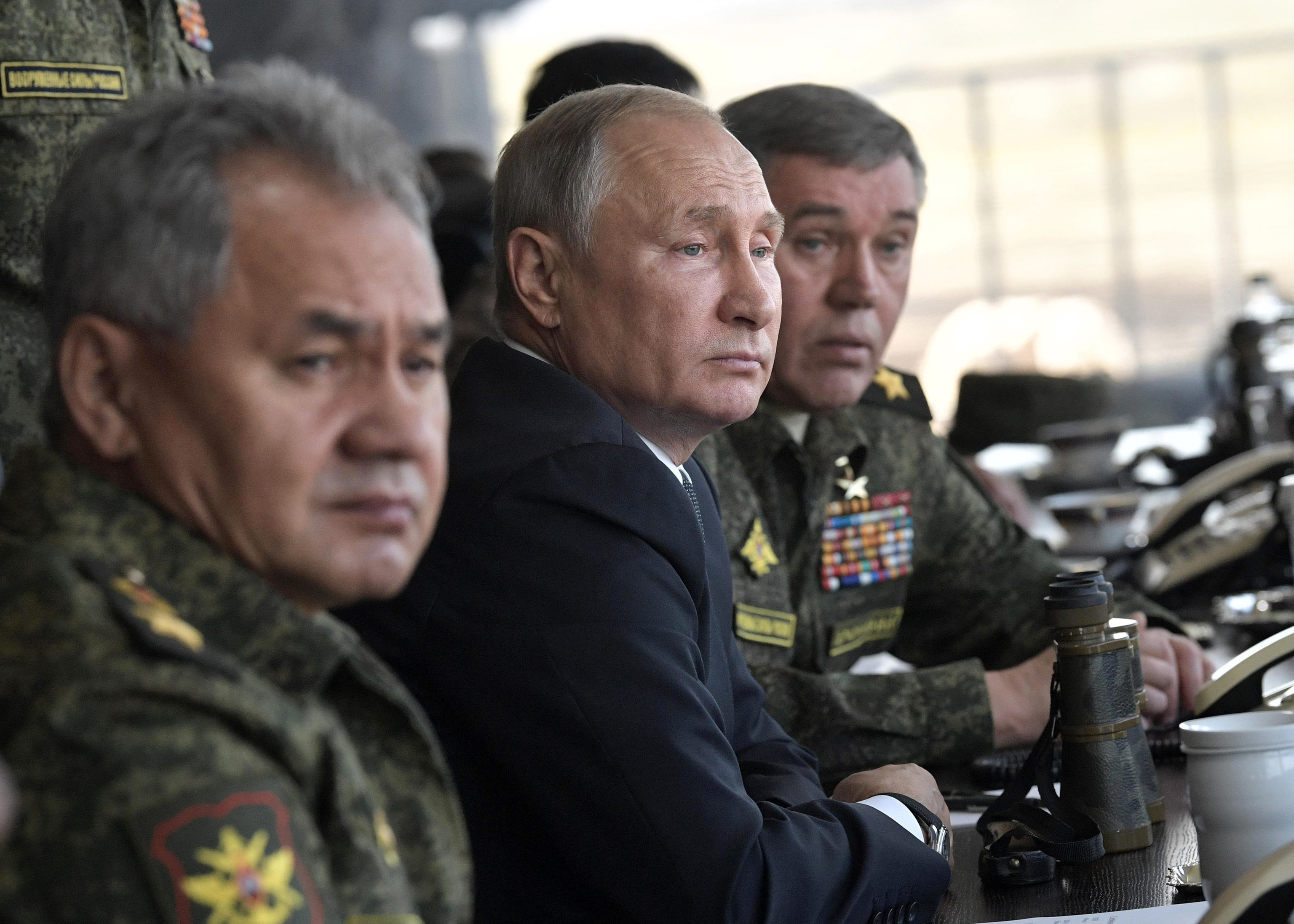 Russian President Vladimir Putin, center, Russian Defense Minister Sergei Shoigu, left, and Head of the General Staff of the Armed Forces of Russia and First Deputy Defense Minister Valery Gerasimov