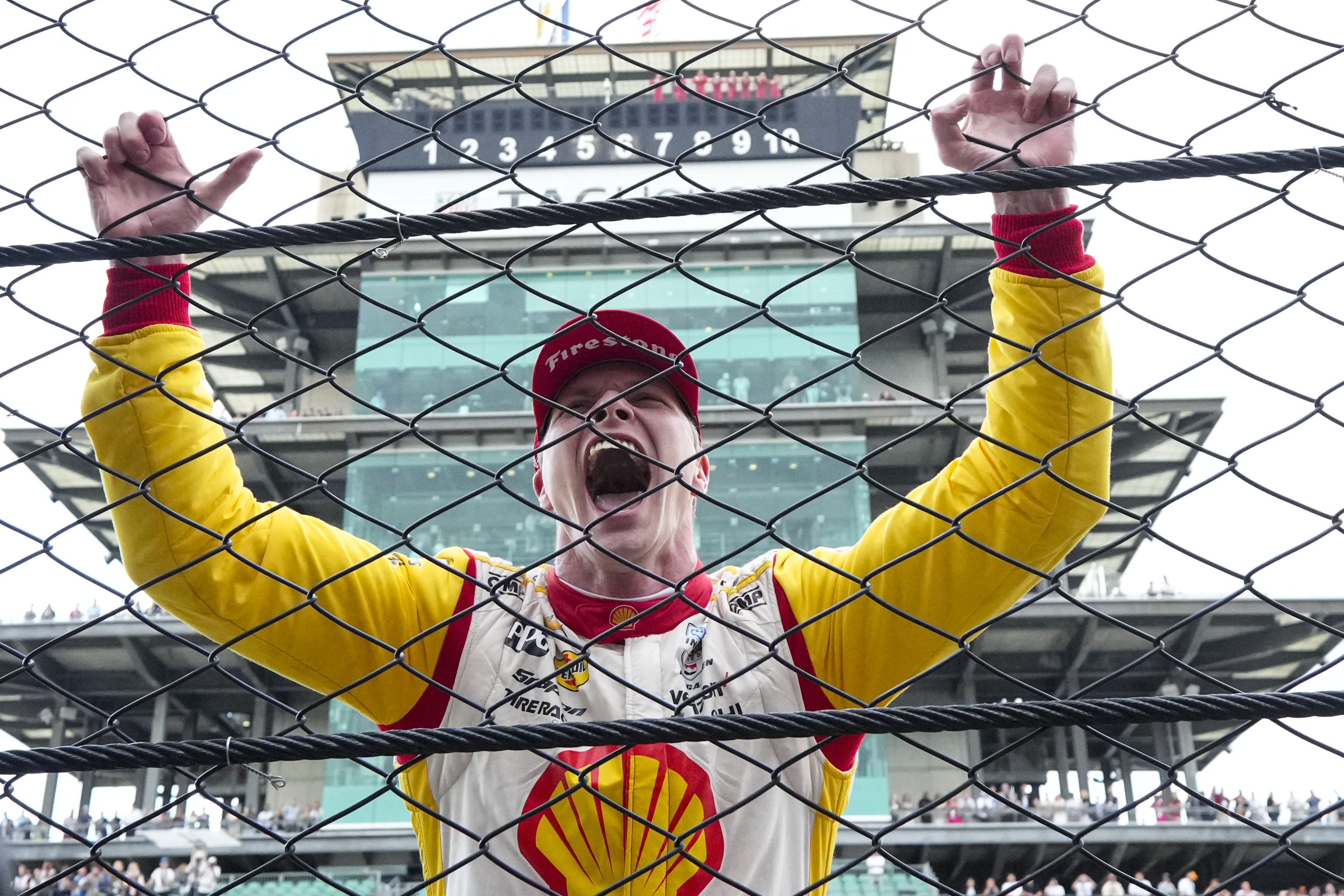 Josef Newgarden celebrates after winning the Indianapolis 500 auto race at Indianapolis Motor Speedway in Indianapolis.