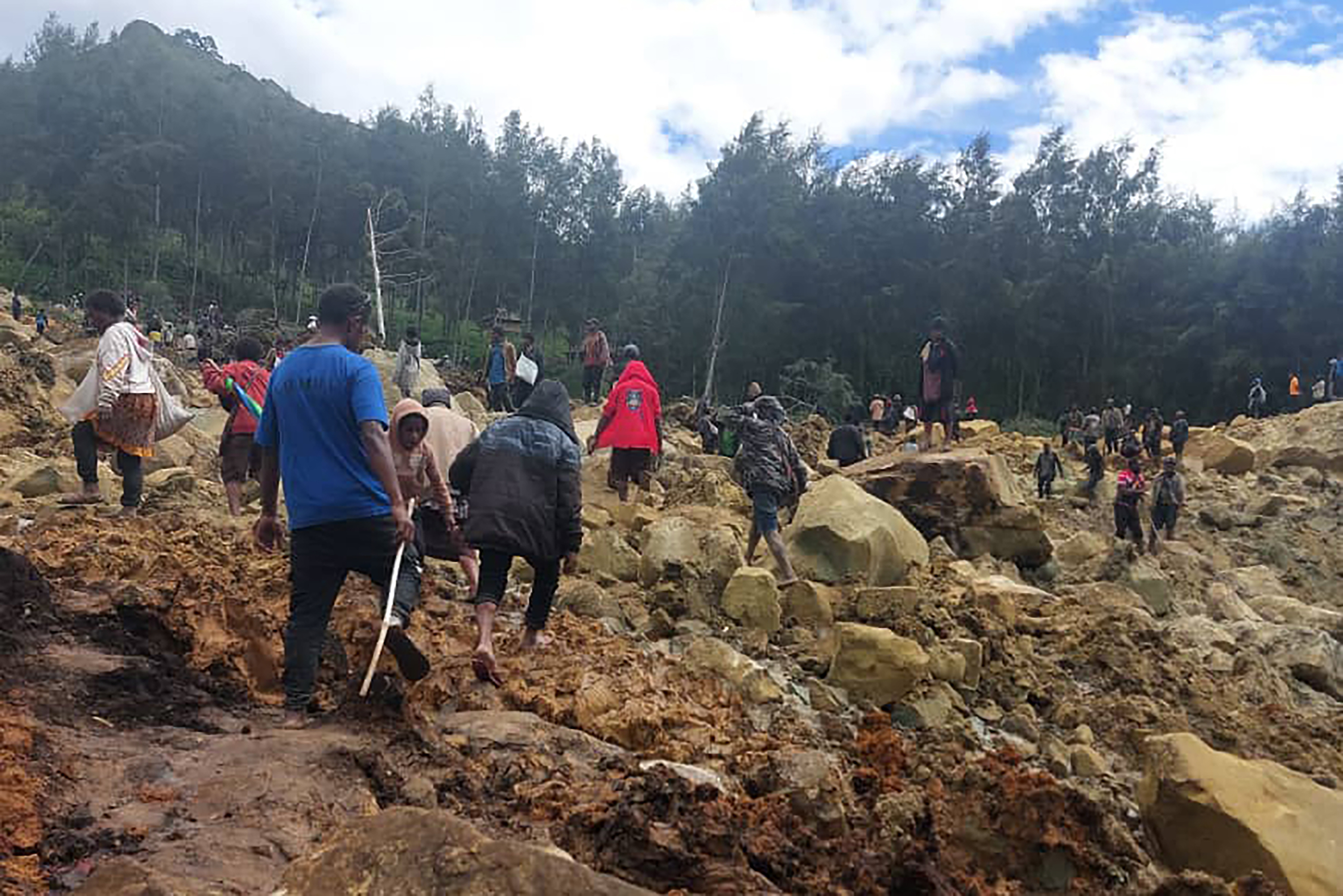 More than 100 people are believed to have been killed in the landslide that buried a village.