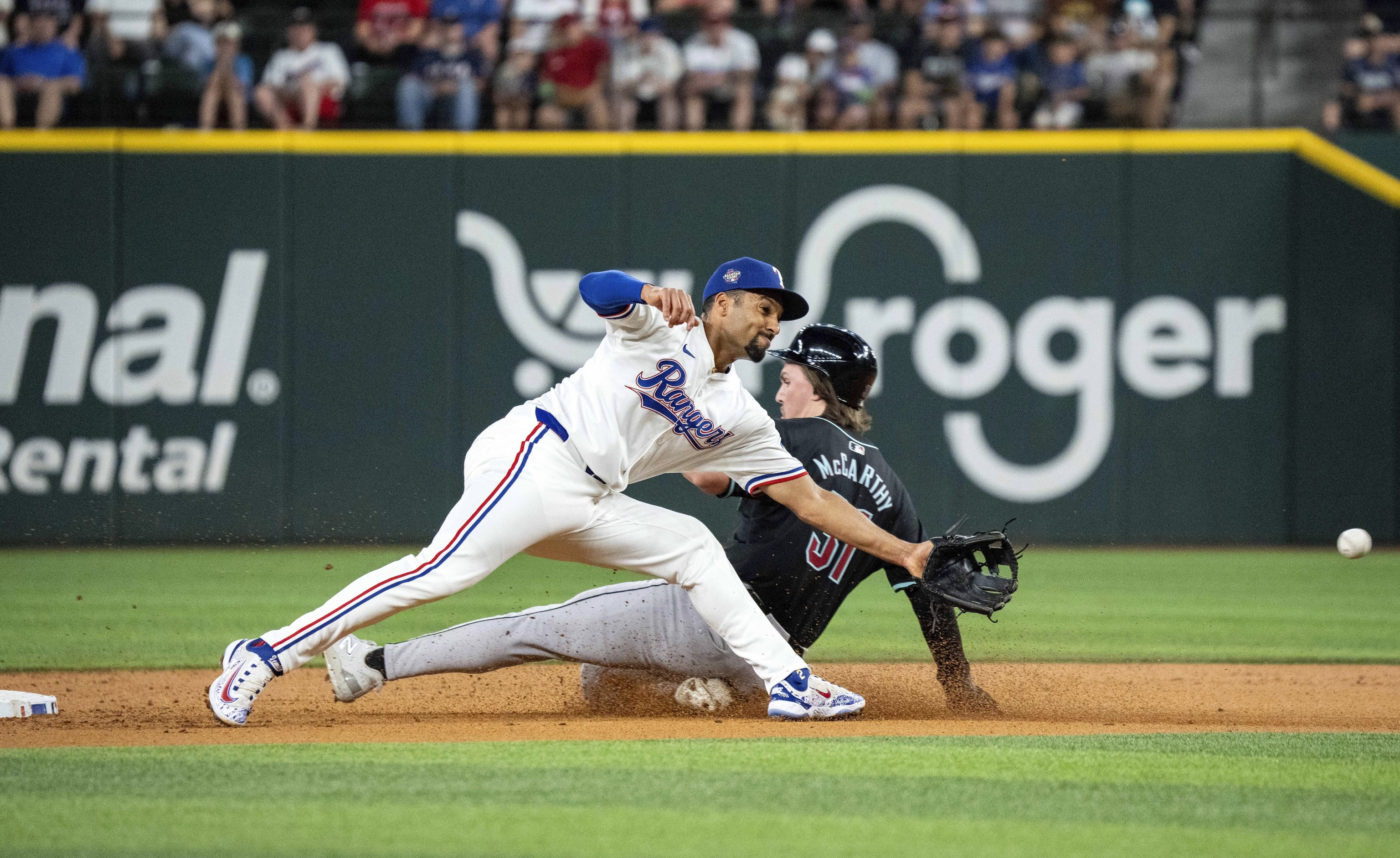 Arizona Diamondbacks' Jake McCarthy steals second past Texas Rangers second base Marcus Semien