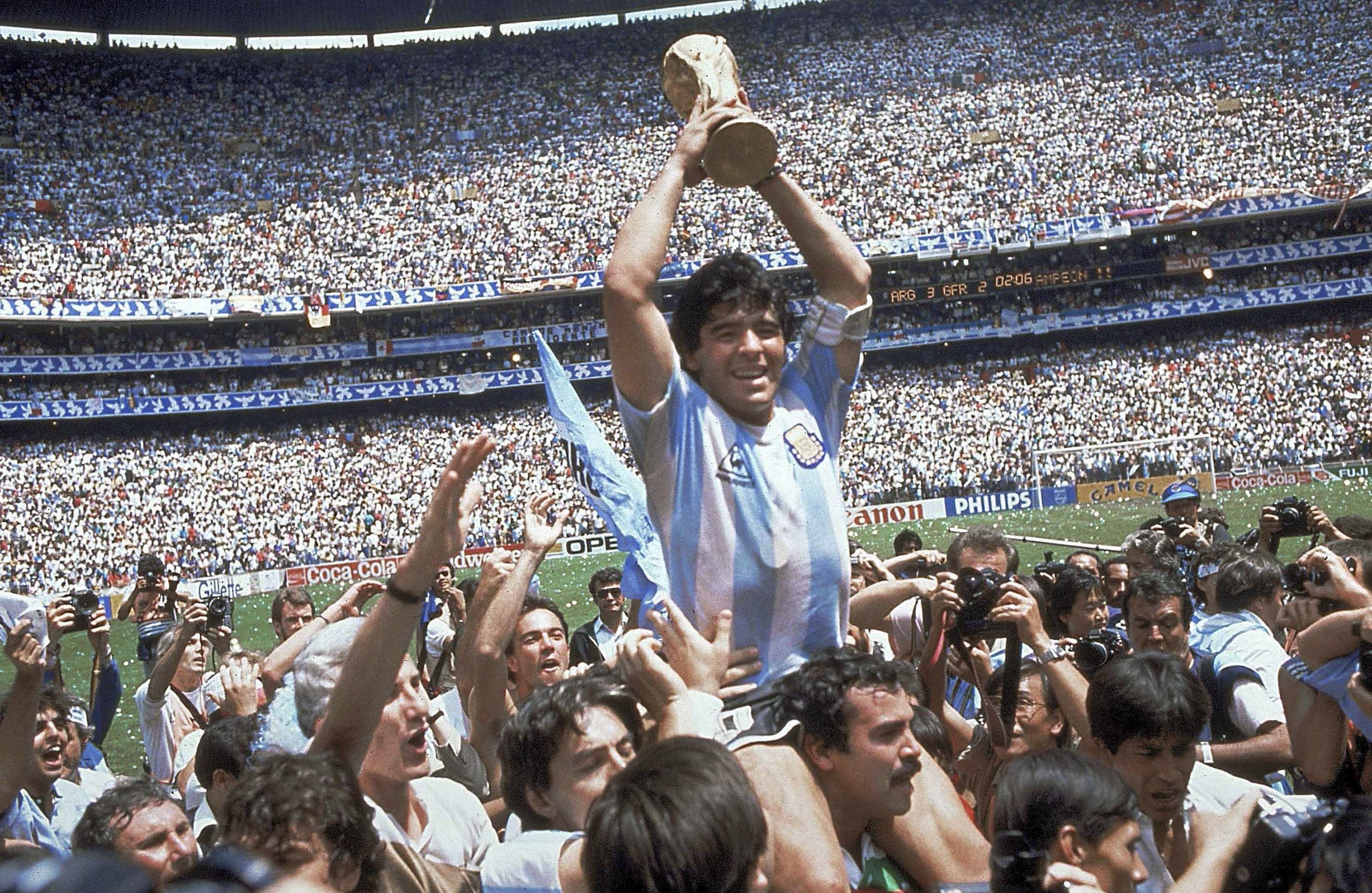 Diego Maradona of Argentina celebrates with the cup at the end of the World Cup