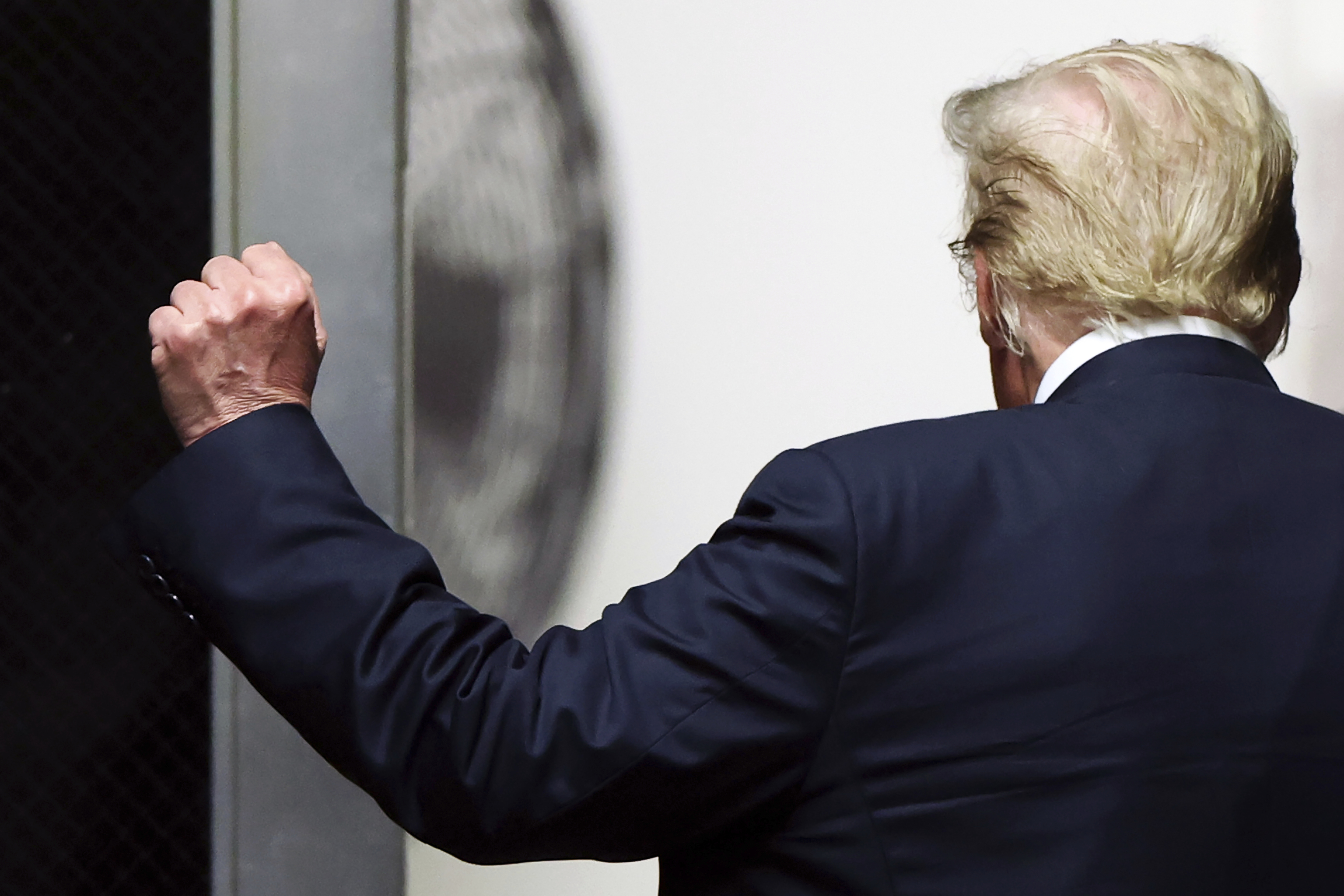 Former President Donald Trump walks to the courtroom at Manhattan criminal court