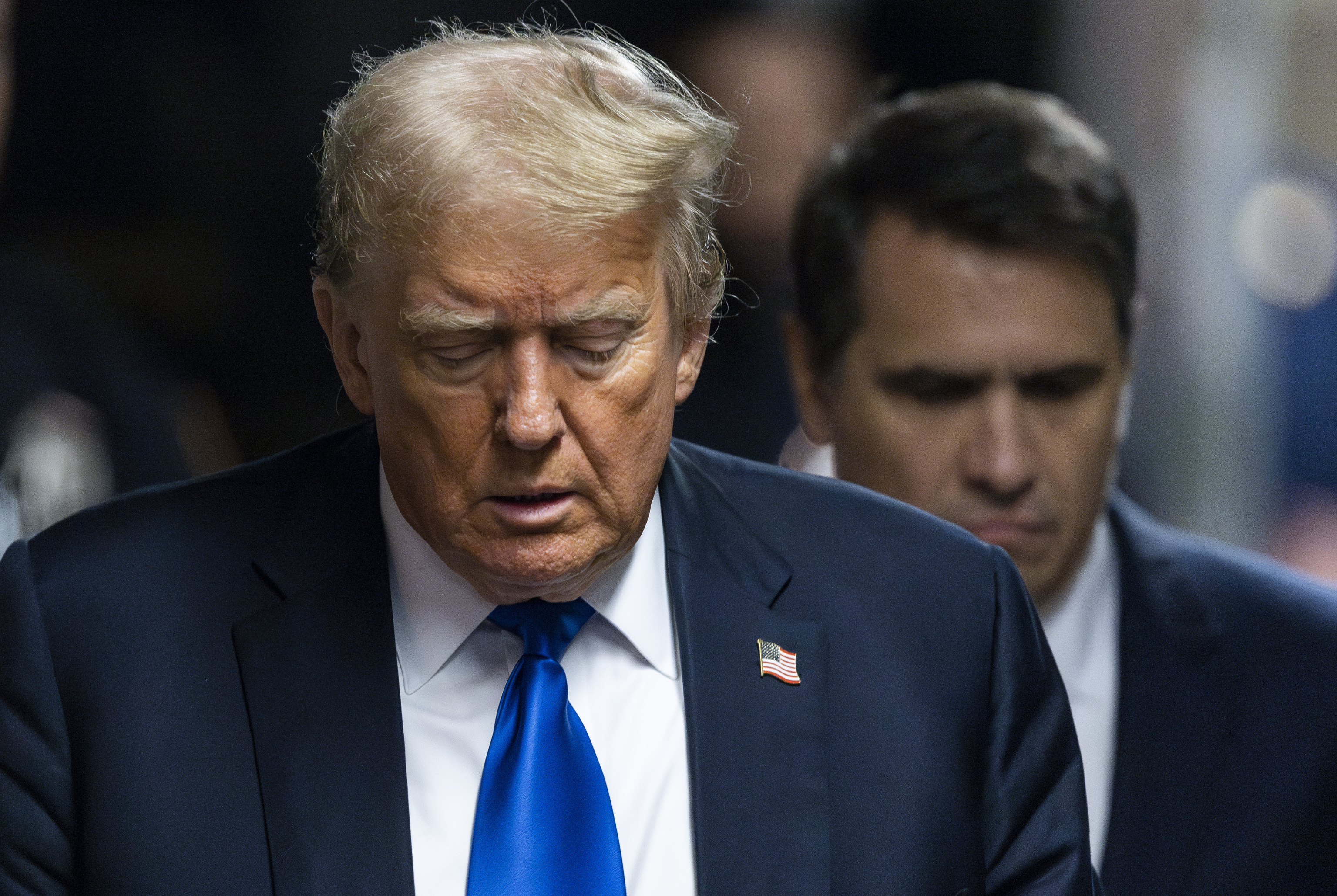 Former President Donald Trump arrives to the courthouse.