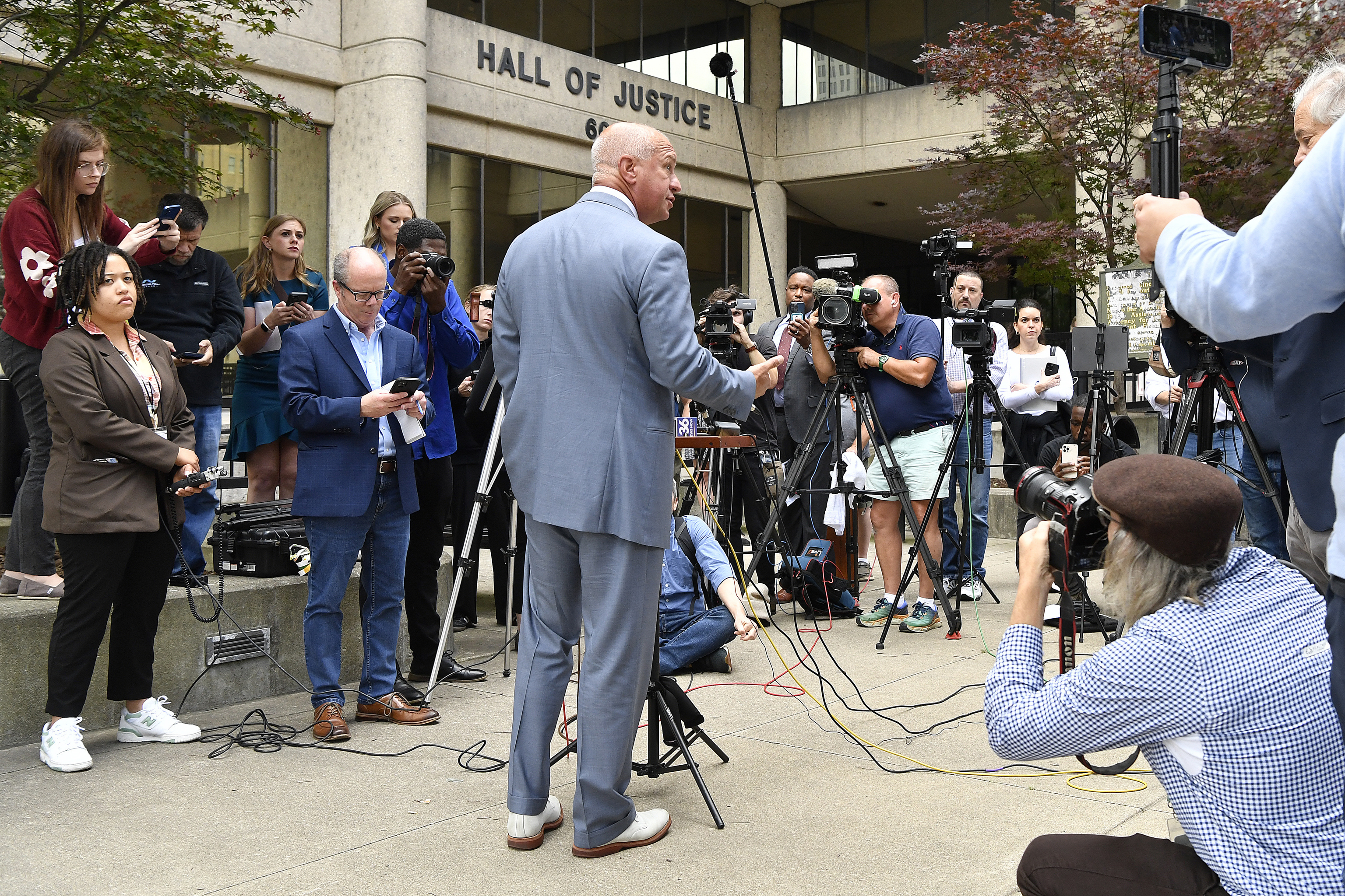 Steve Romines, attorney for golfer Scottie Scheffler, addresses reporters.