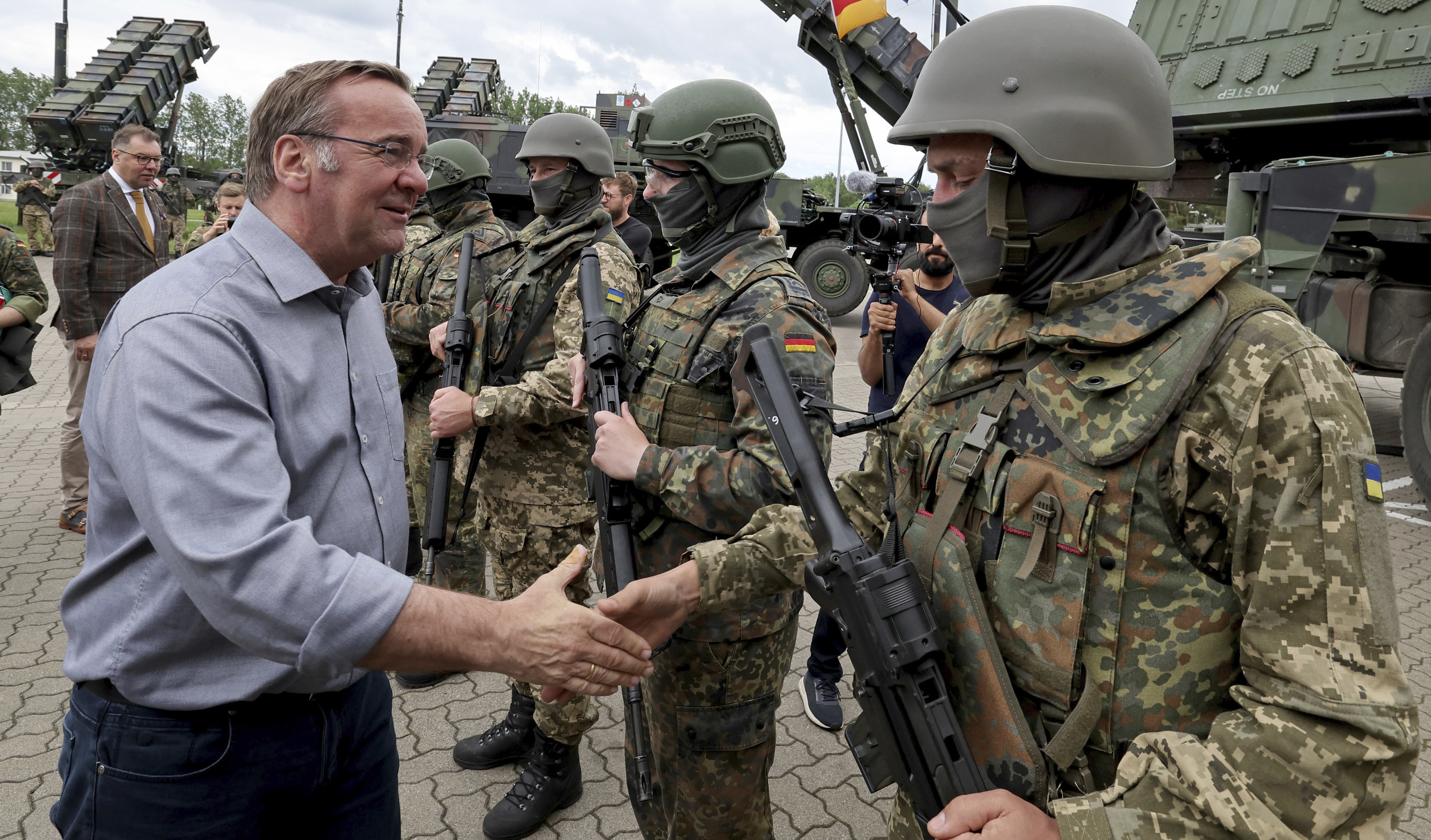 German Defence Minister Boris Pistorius, left, visits the Air Defence Missile Group 21 at a military training area