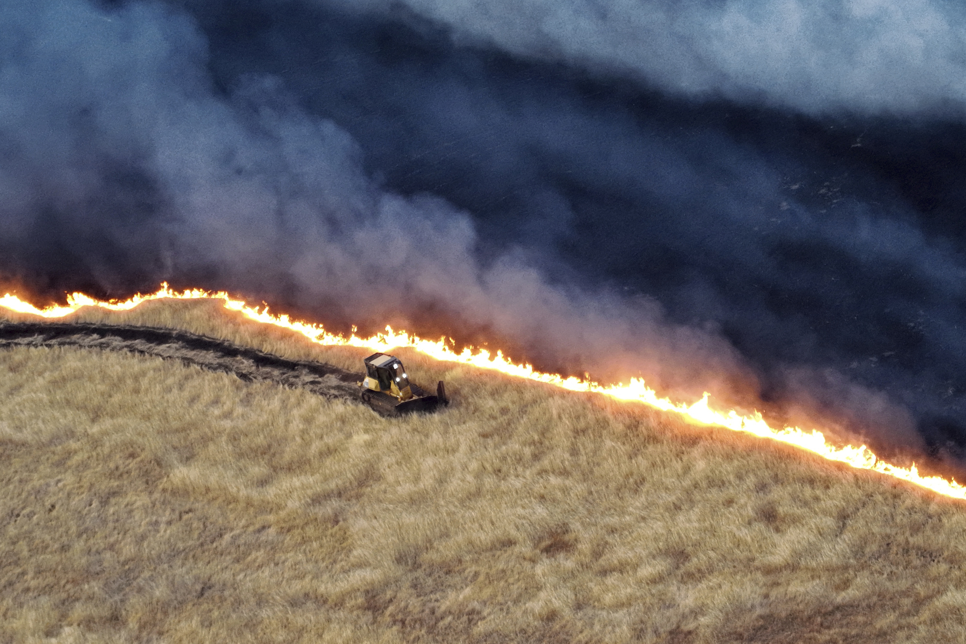 A bulldozer working against the Corral Fire.