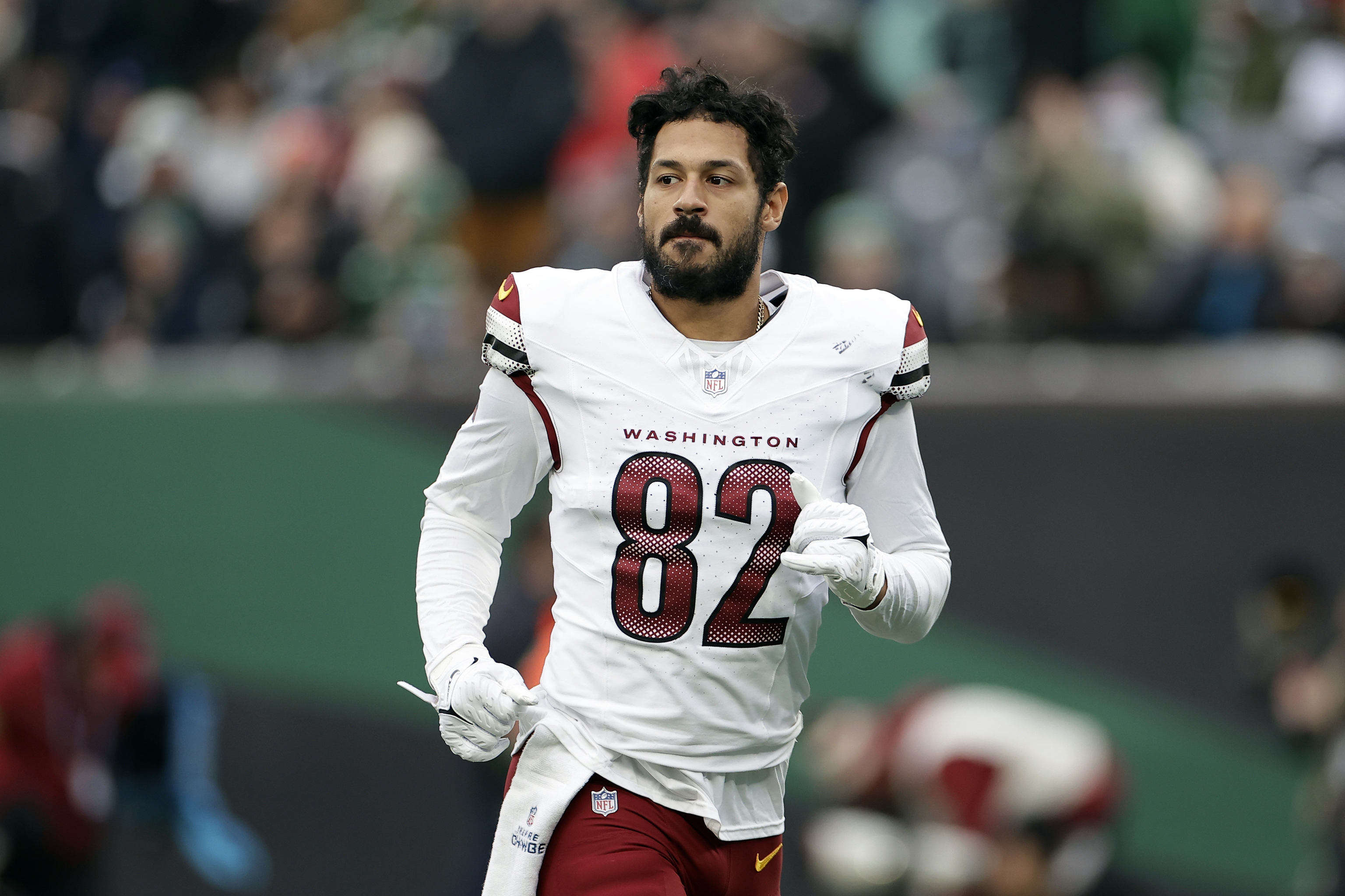 Tight end Logan Thomas runs off the field.