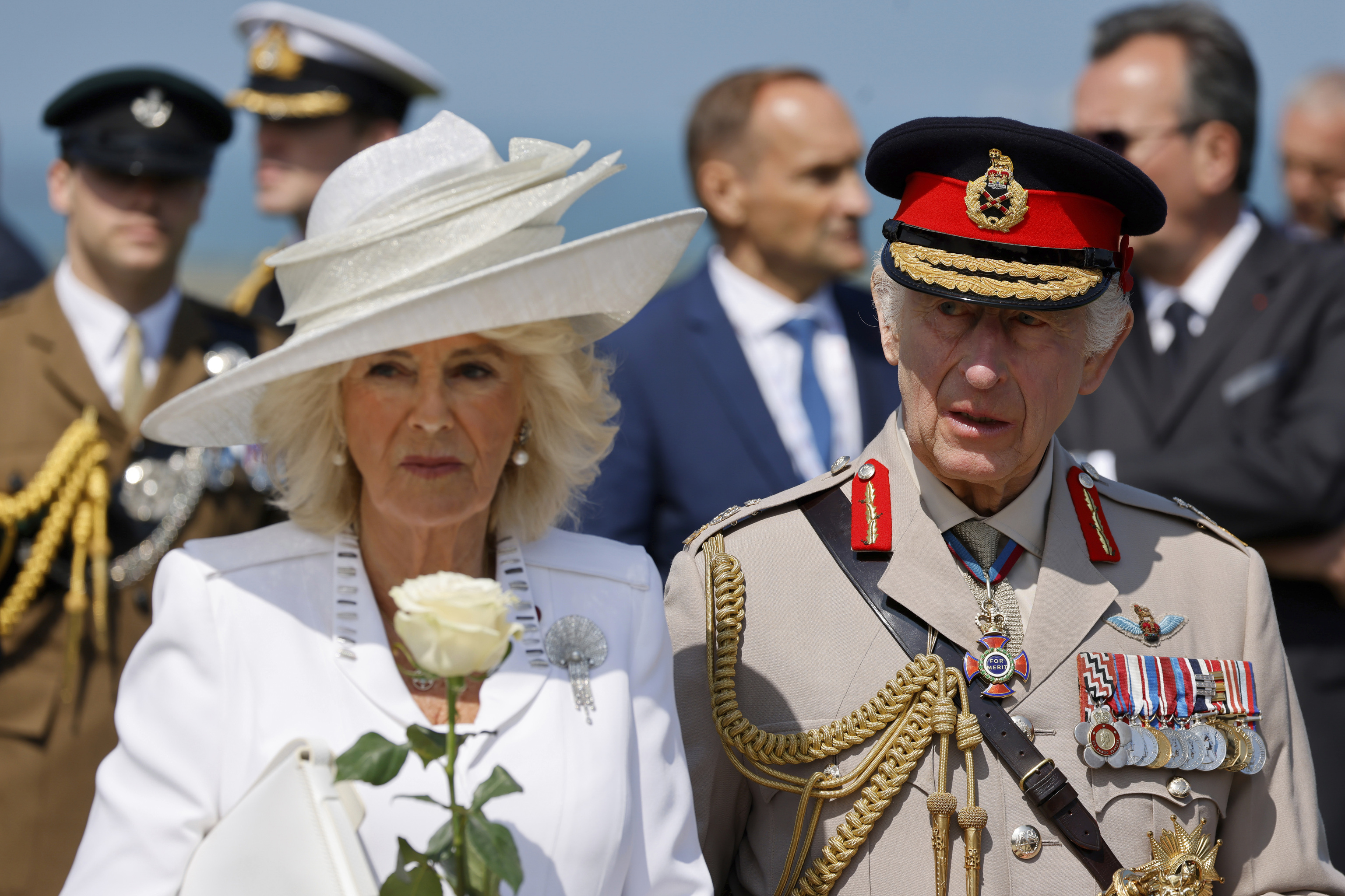 Britain's King Charles III and Britain's Queen Camilla attend a commemorative ceremony marking the 80th anniversary.