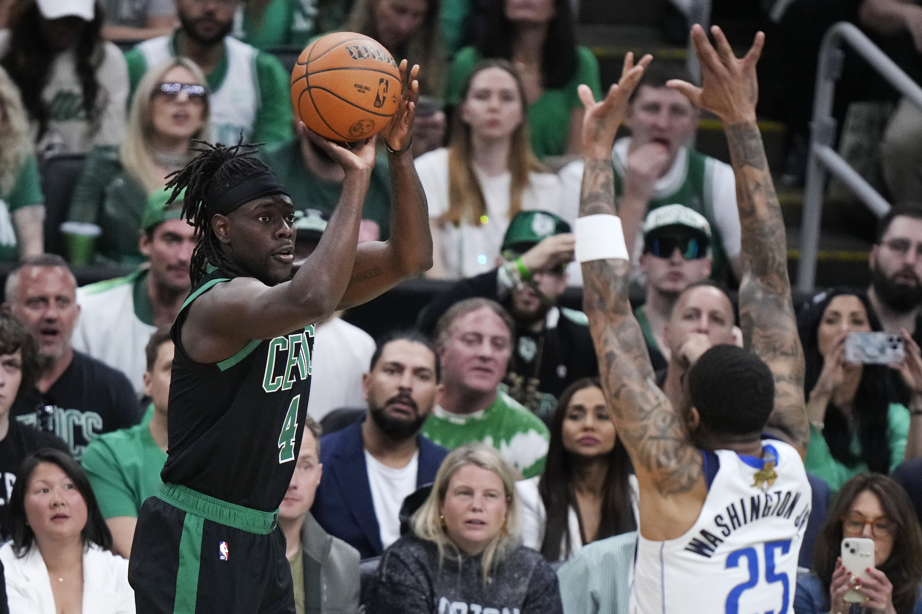Boston Celtics guard Jrue Holiday takes a shot.