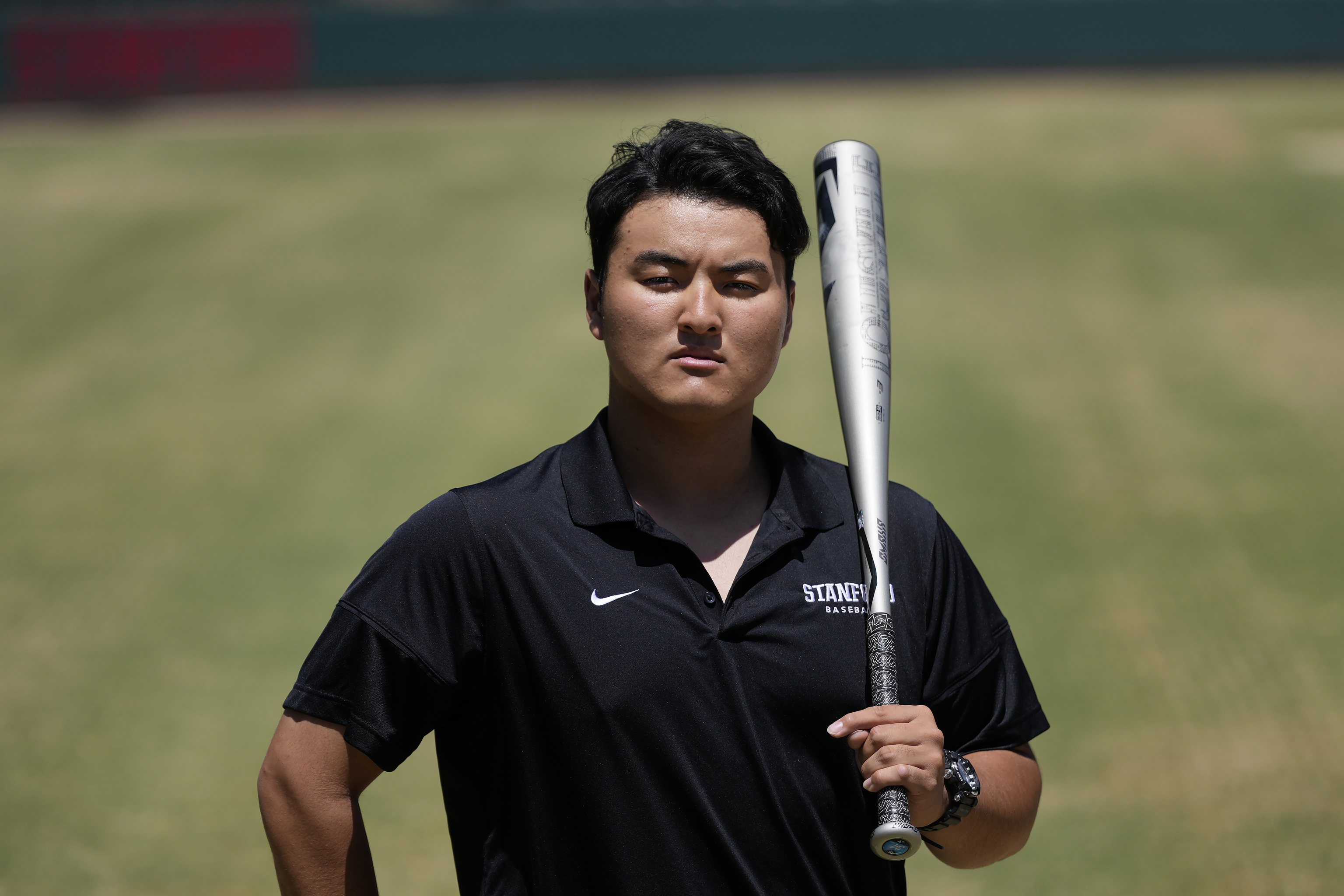 Rintaro Sasaki poses for photos at the Sunken Diamond baseball field at Stanford University