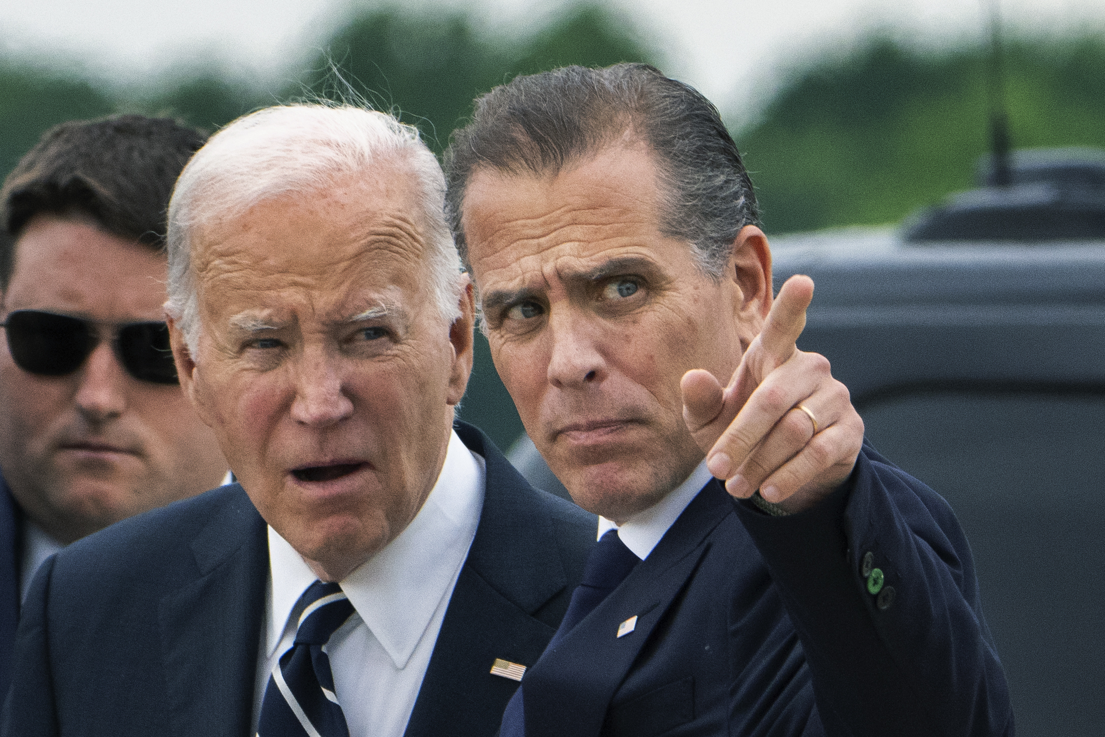 President Joe Biden talks with his son Hunter Biden.