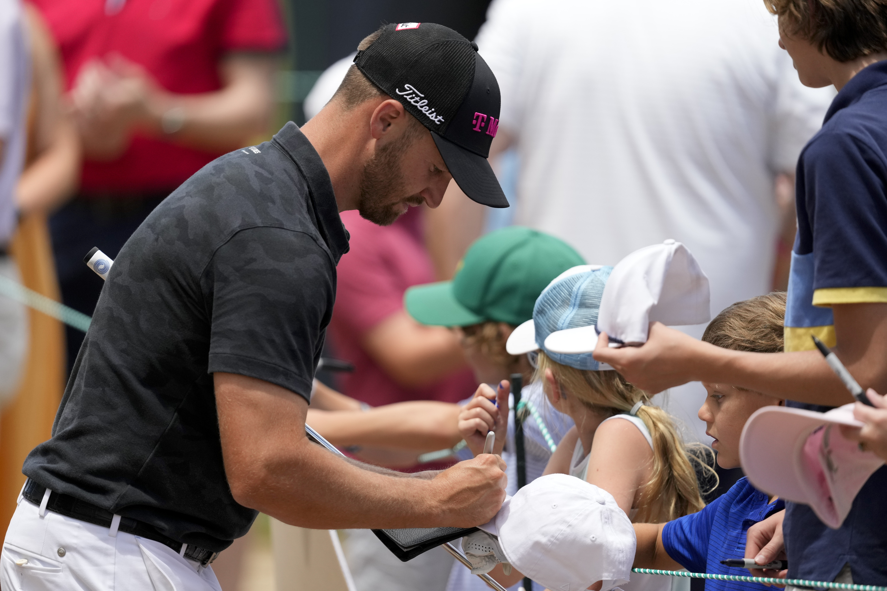 Wyndham Clark signs autographs.