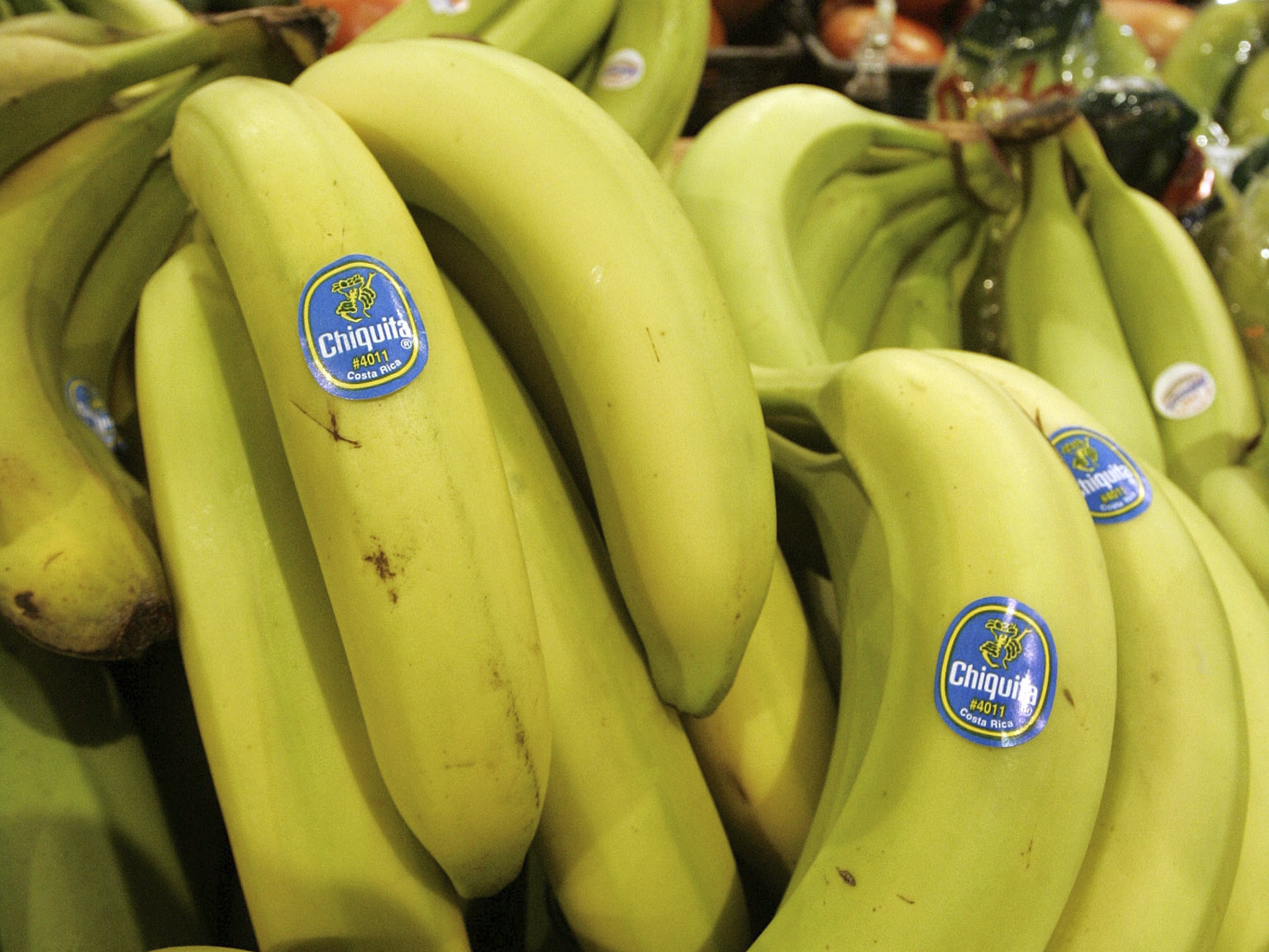 Chiquita bananas are piled on display at the Heinen's grocery store.