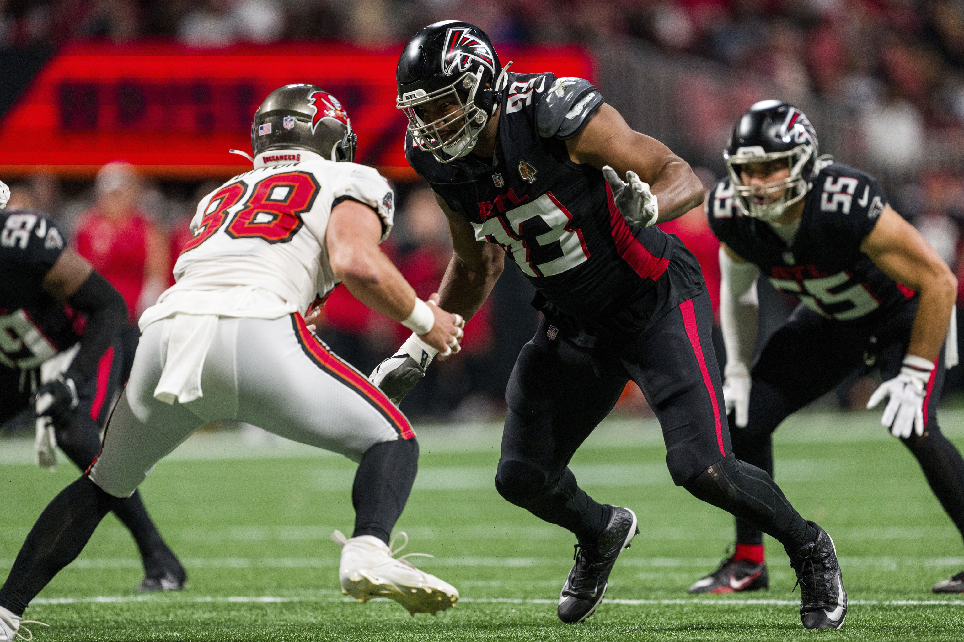 Atlanta Falcons defensive tackle Calais Campbell (93) works against Tampa Bay Buccaneers tight end Cade Otton.