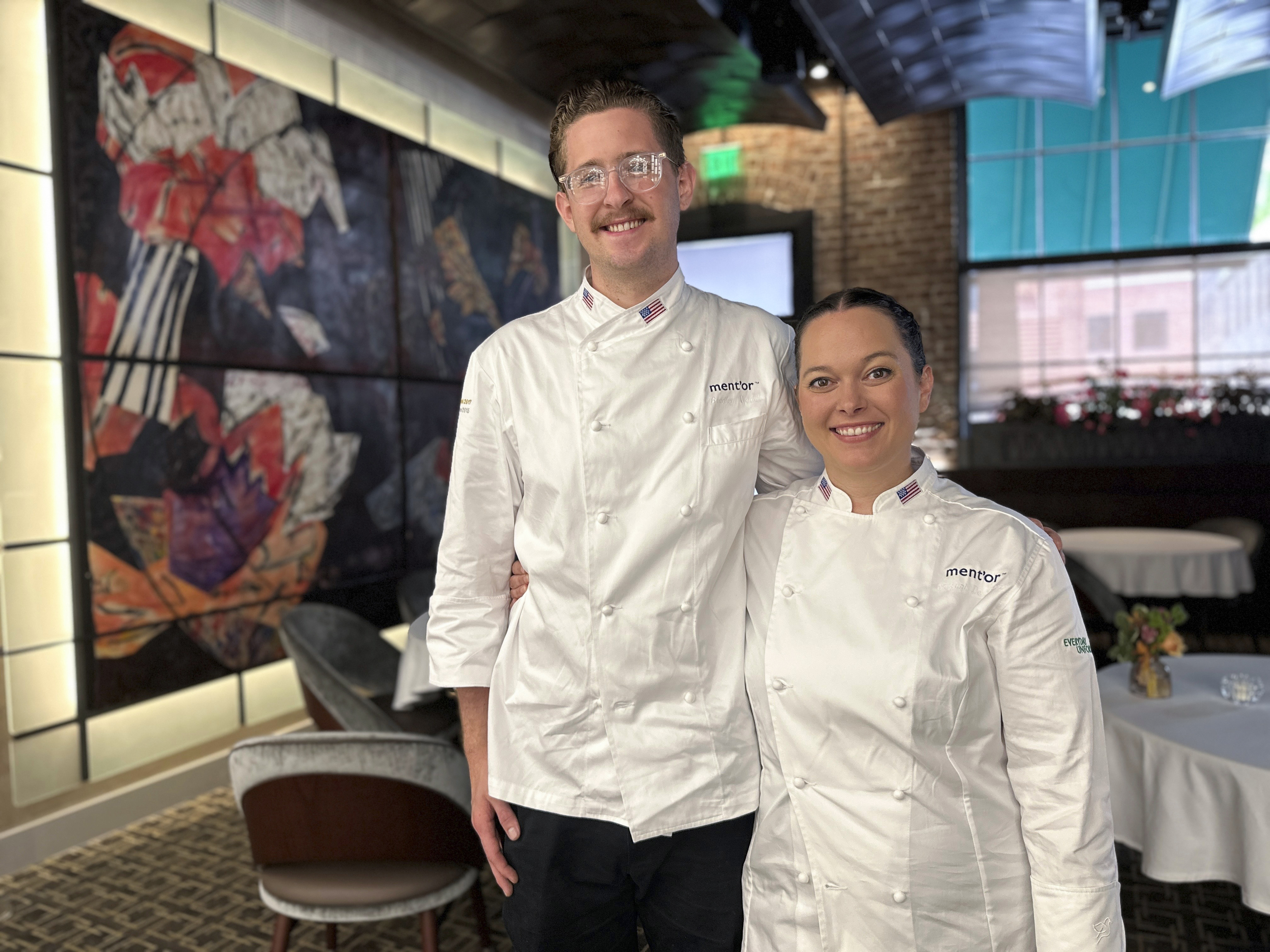 Bradley Waddle, left, stands with Stefani De Palma at Emeril's restaurant.