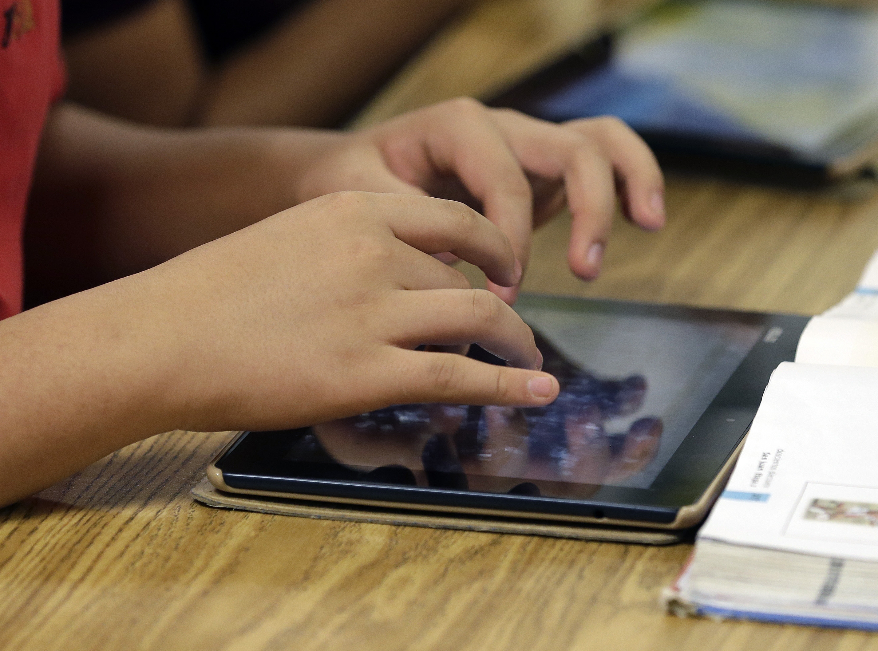 A student uses a tablet.