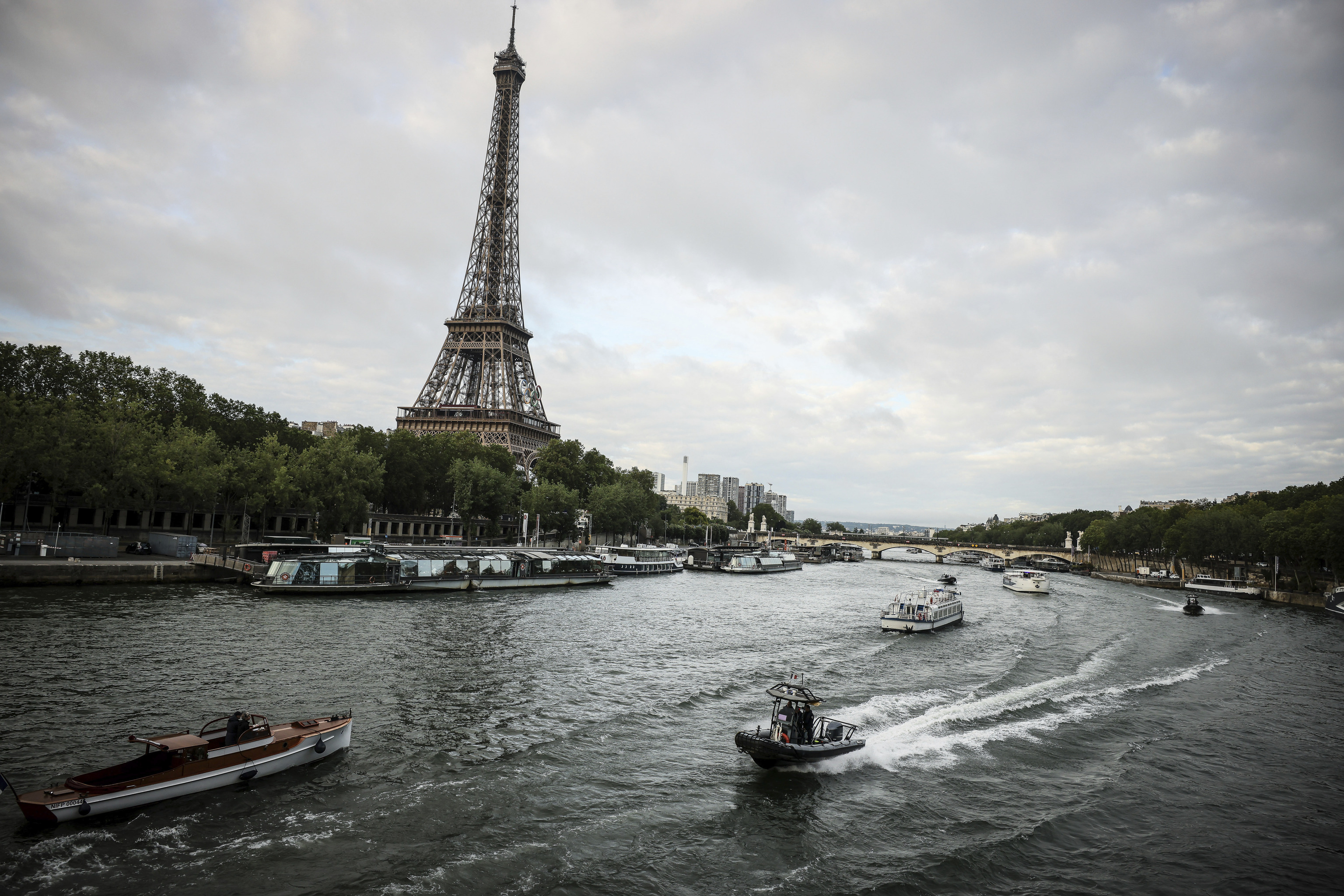 Barges cruise on the Seine river during a rehearsal for the Paris 2024 Olympic Games opening ceremony.