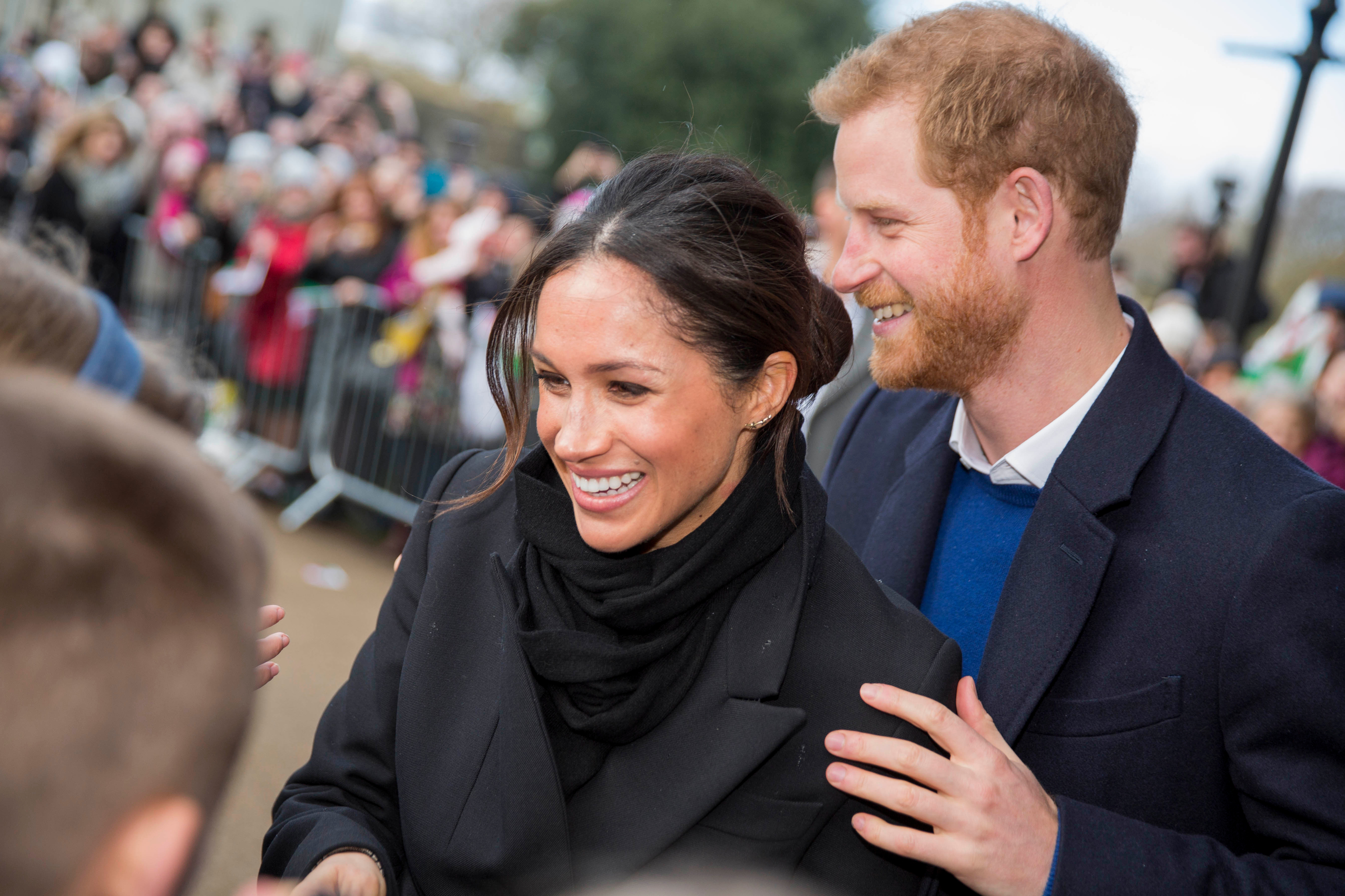 Prince Harry and Meghan Markle on a greet in Cardiff, Wales, in 2018.