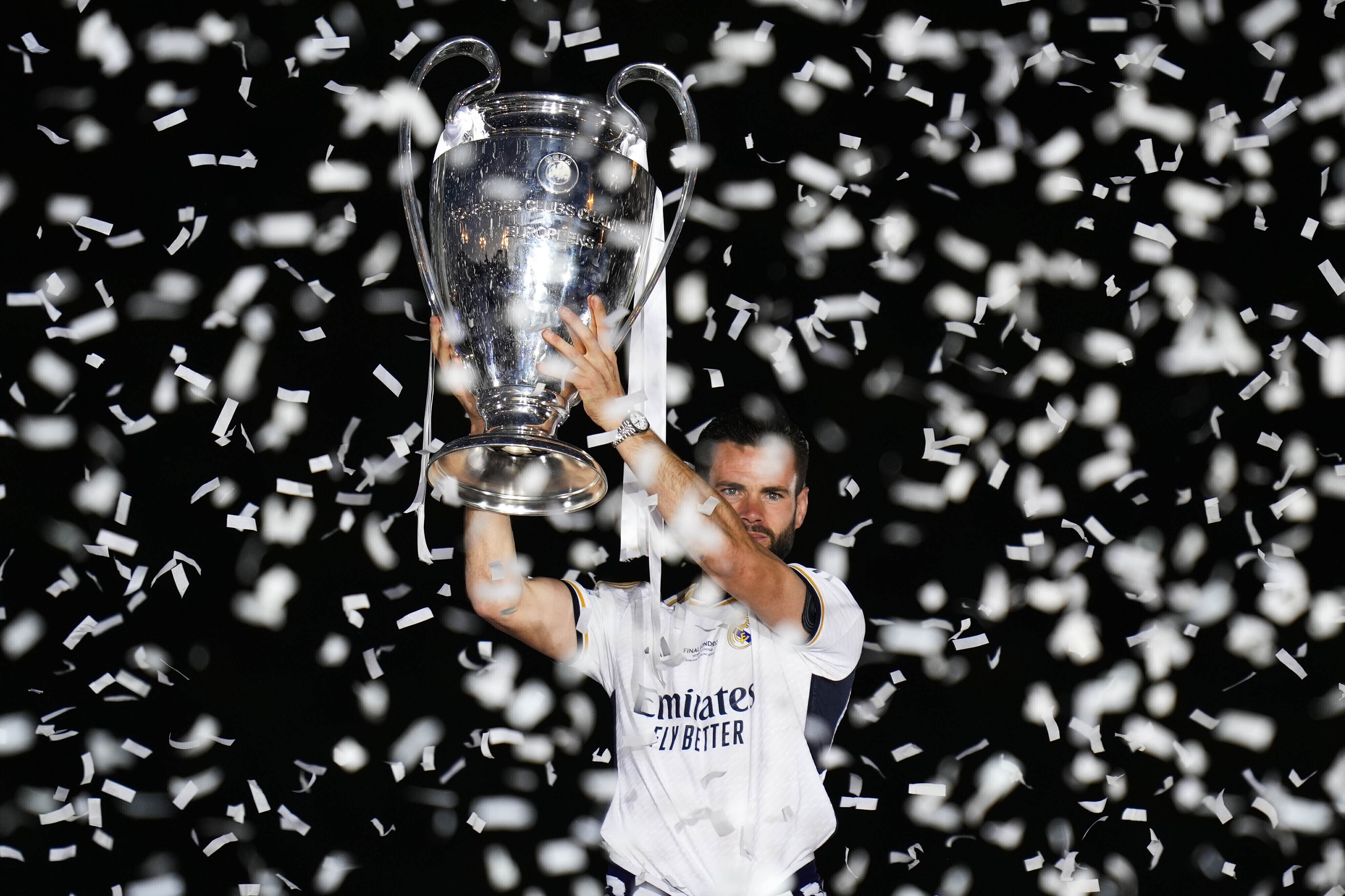 Real Madrid's Nacho holds the Champions League trophy.