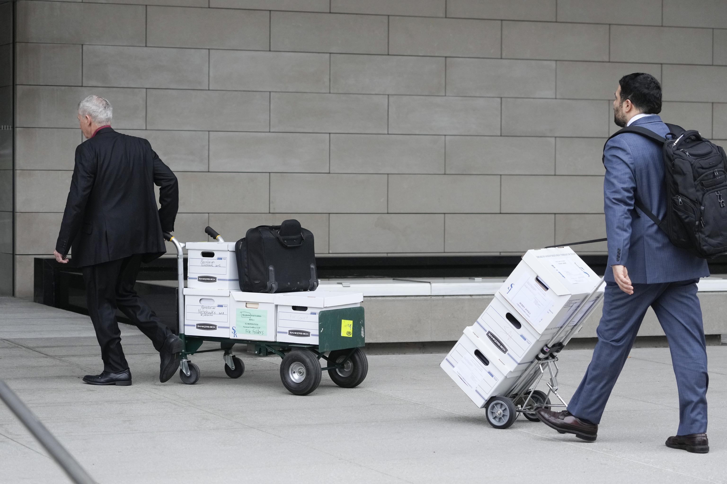 Documents to support Dallas Cowboys owner Jerry Jones' testimony are wheeled into federal court.