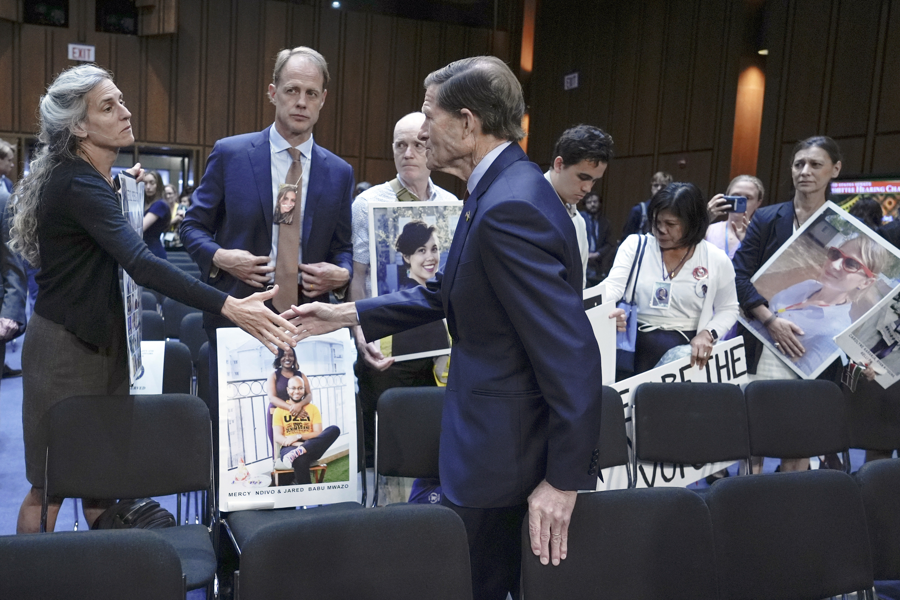 Sen. Richard Blumenthal, D-Conn., center, visits with family members of victims of Boeing plane crashes