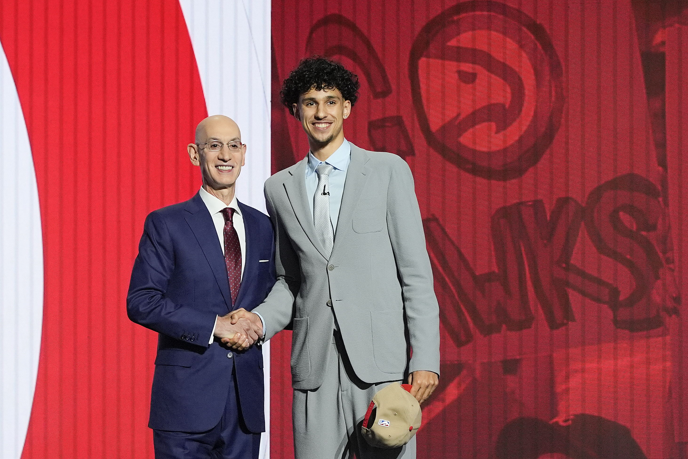 Zaccharie Risacher, right, poses for a photo with NBA commissioner Adam Silver