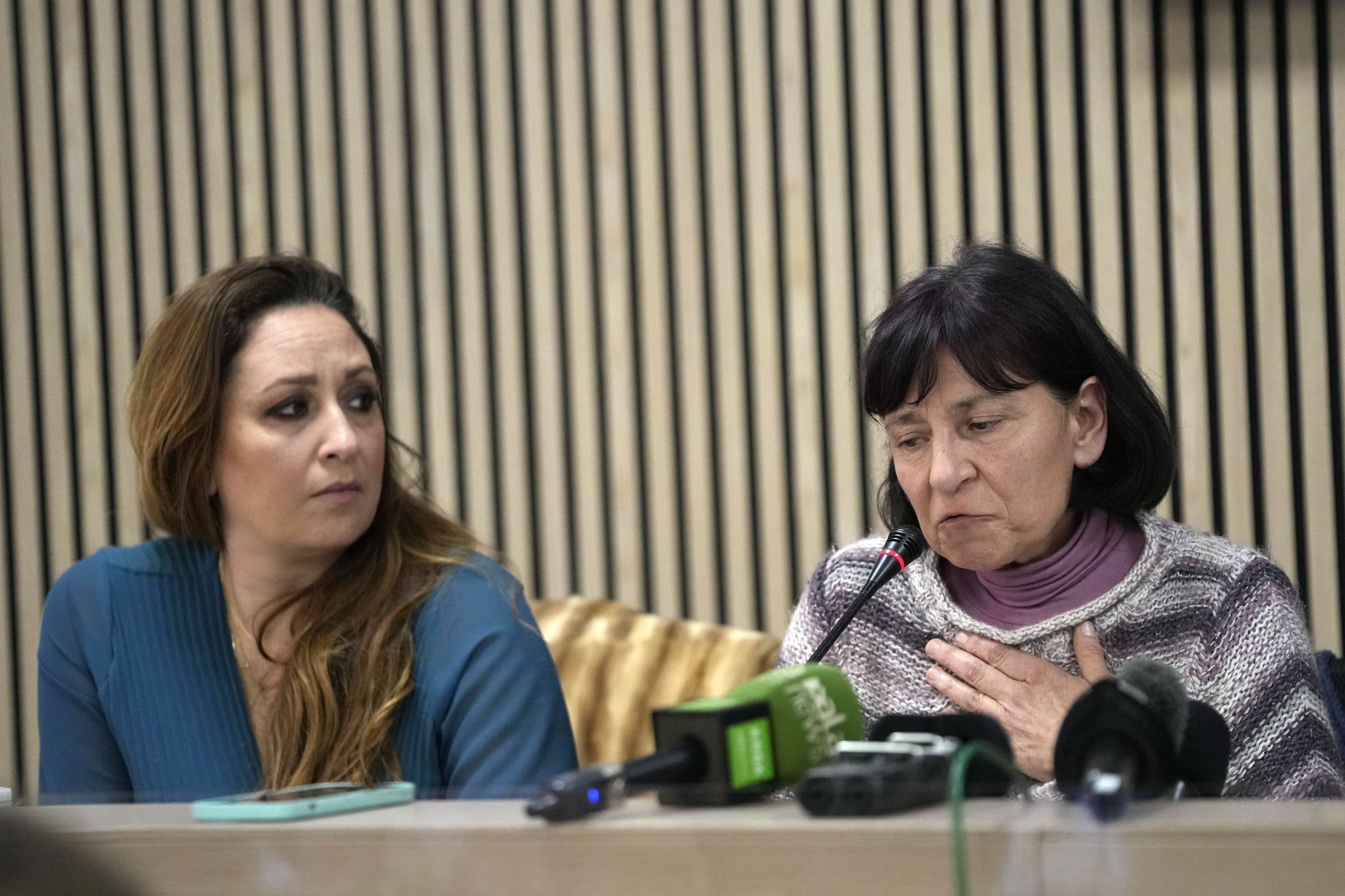 Lawyer Laura Sgro, left, listens to Gloria Branciani during a press conference in Rome