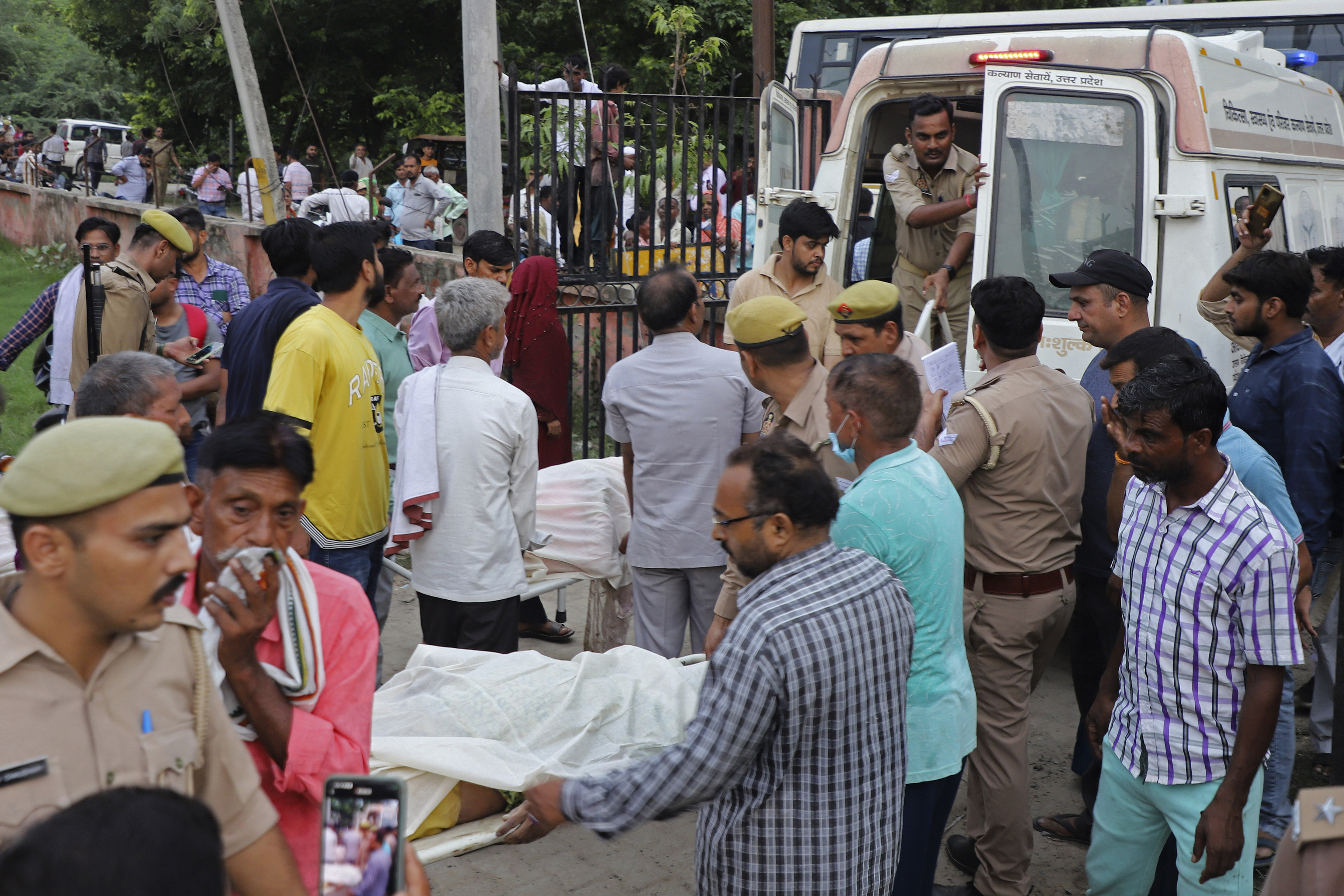 A stampede among thousands of people at a religious gathering in northern India has killed at least 105