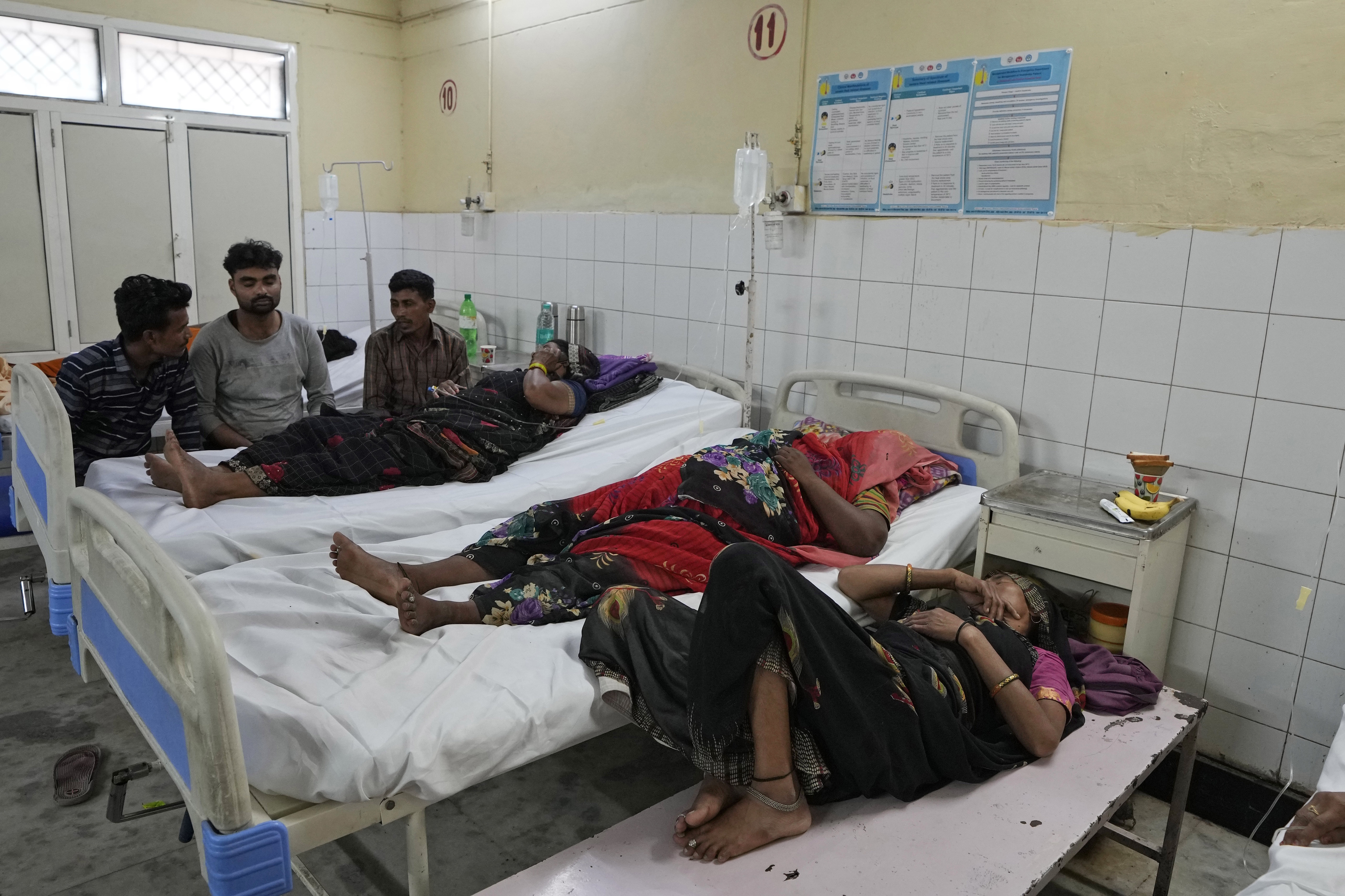 People injured in a stampede receive treatment at Hathras.