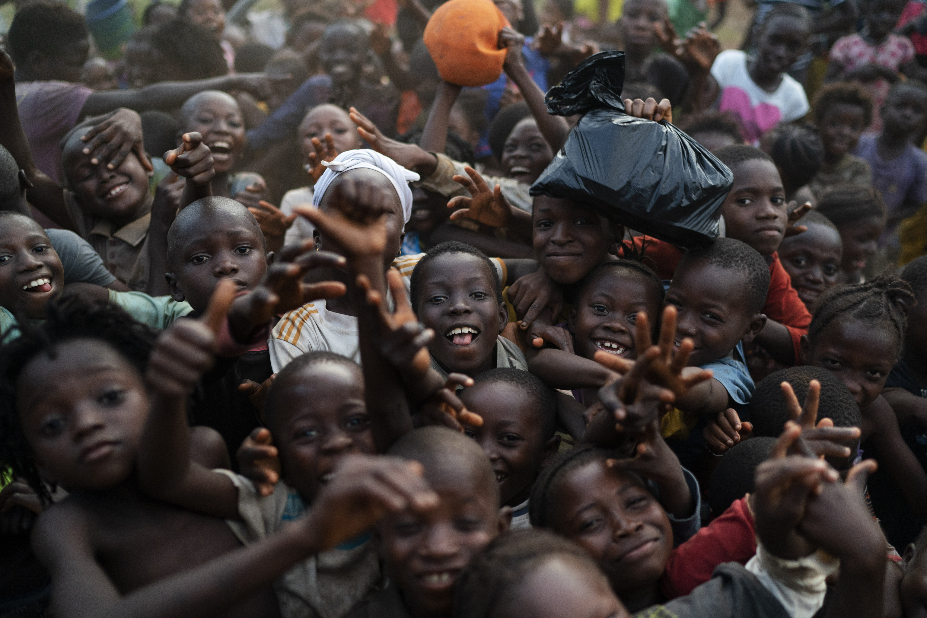 Children pose for a photo in Komao village, on the outskirts of Koidu, district of Kono, Sierra Leone