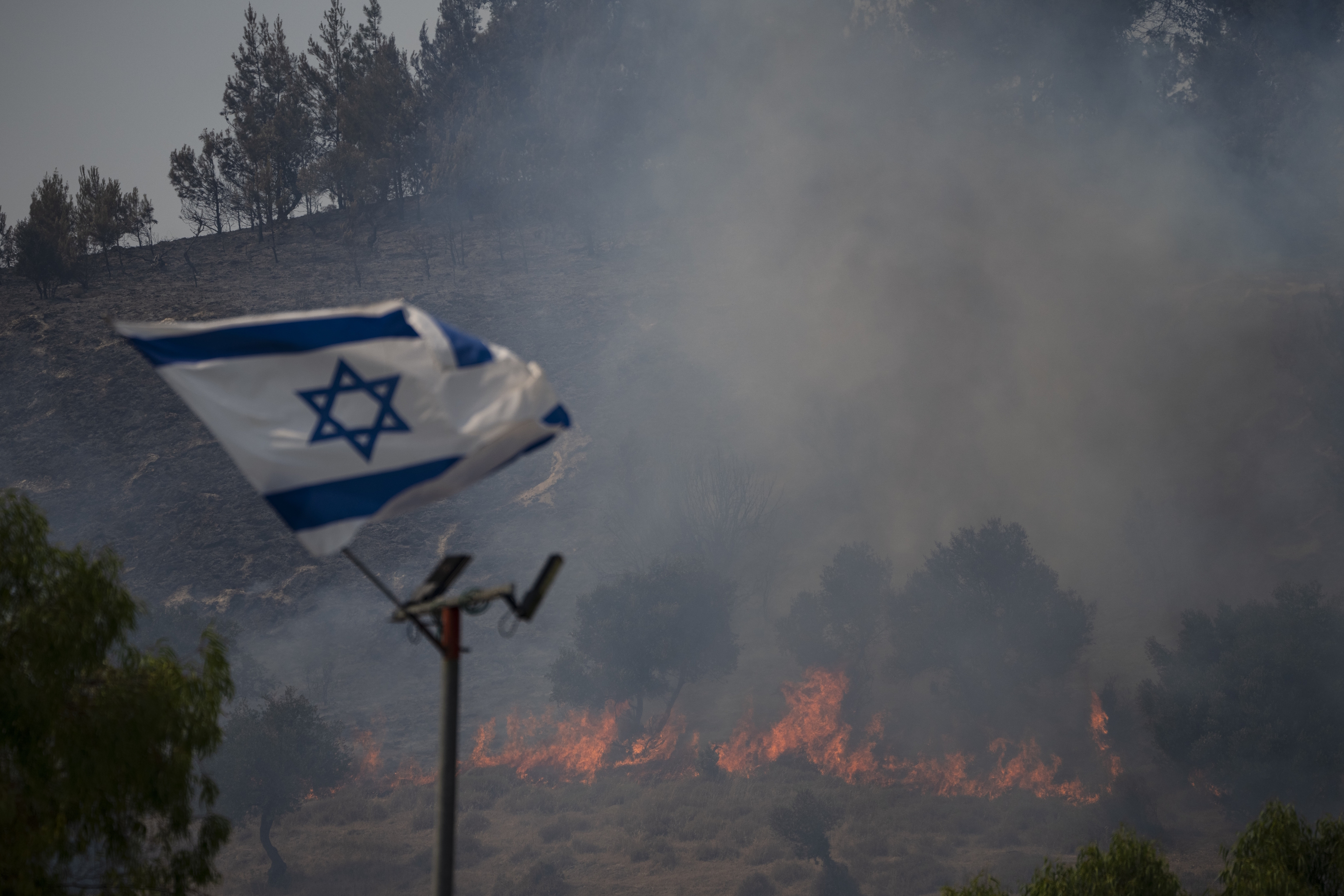 An Israeli flag flutters near the border with Lebanon.