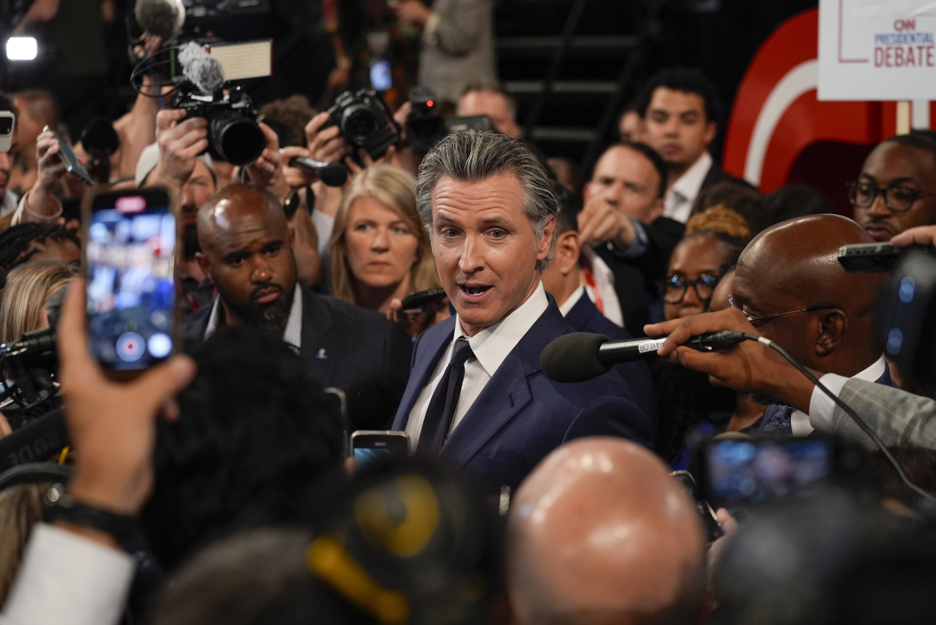 California Gov. Gavin Newsom speaks to reporters.