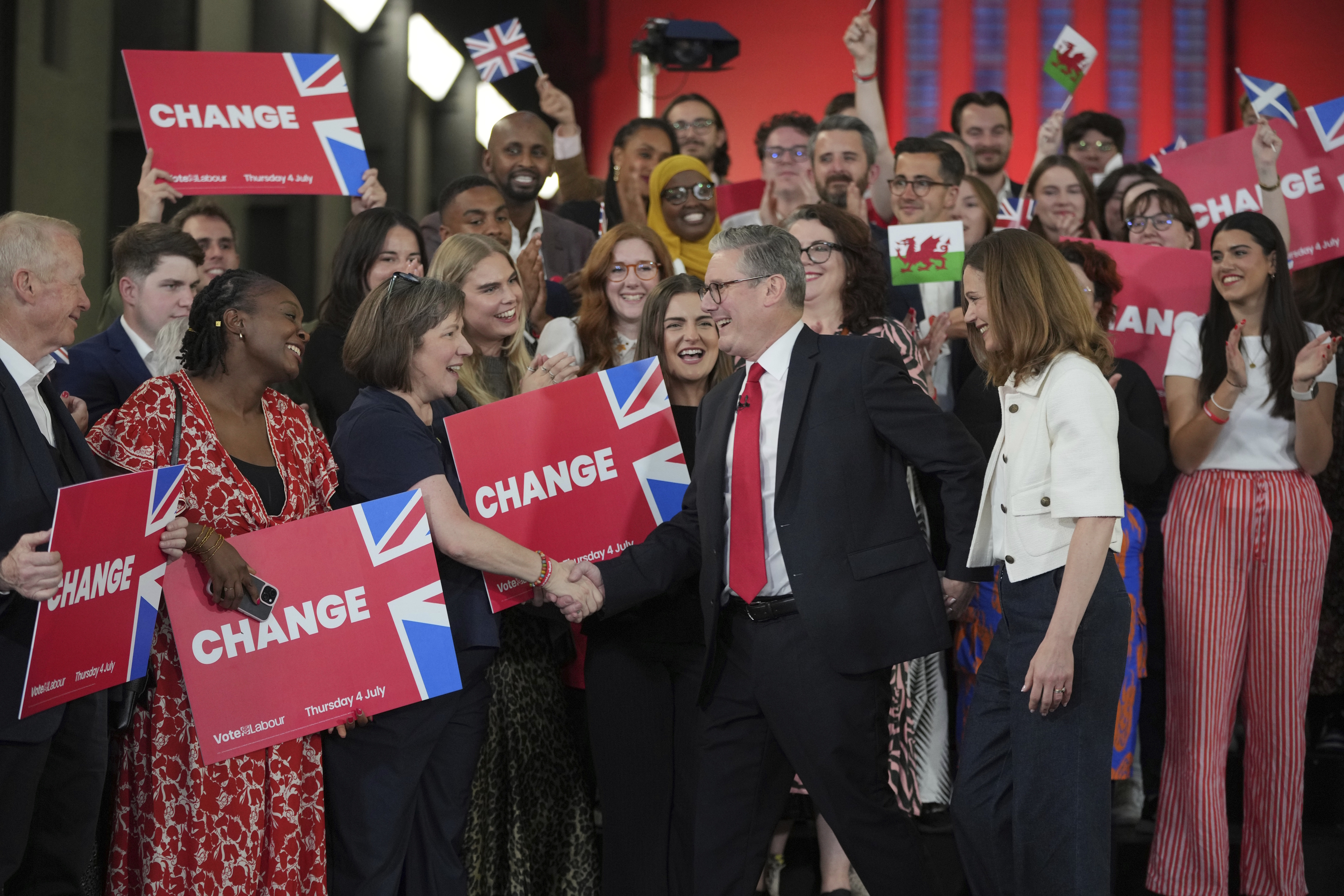 Leader Starmer shakes hands with his supporters.