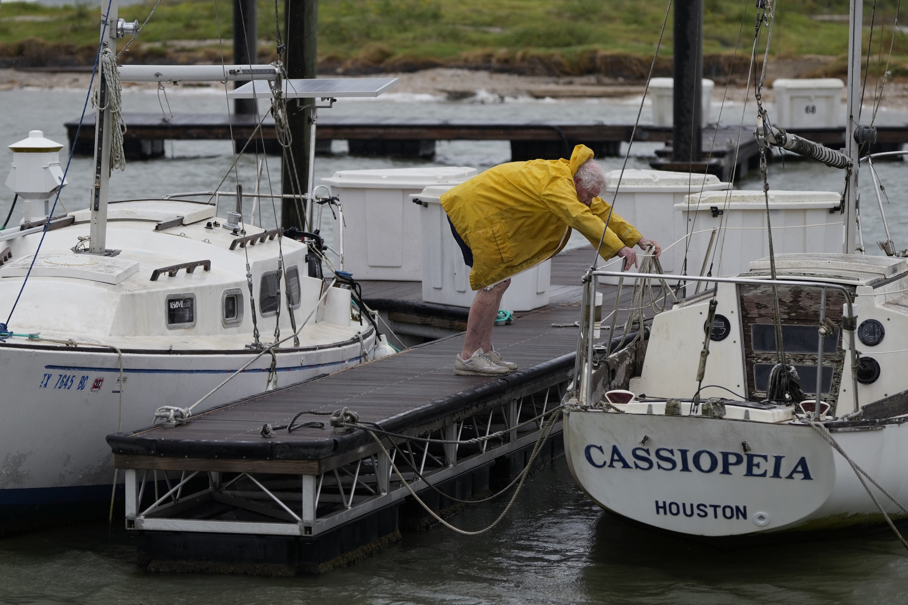 A man works to secure his boat for Beryl's arrival.