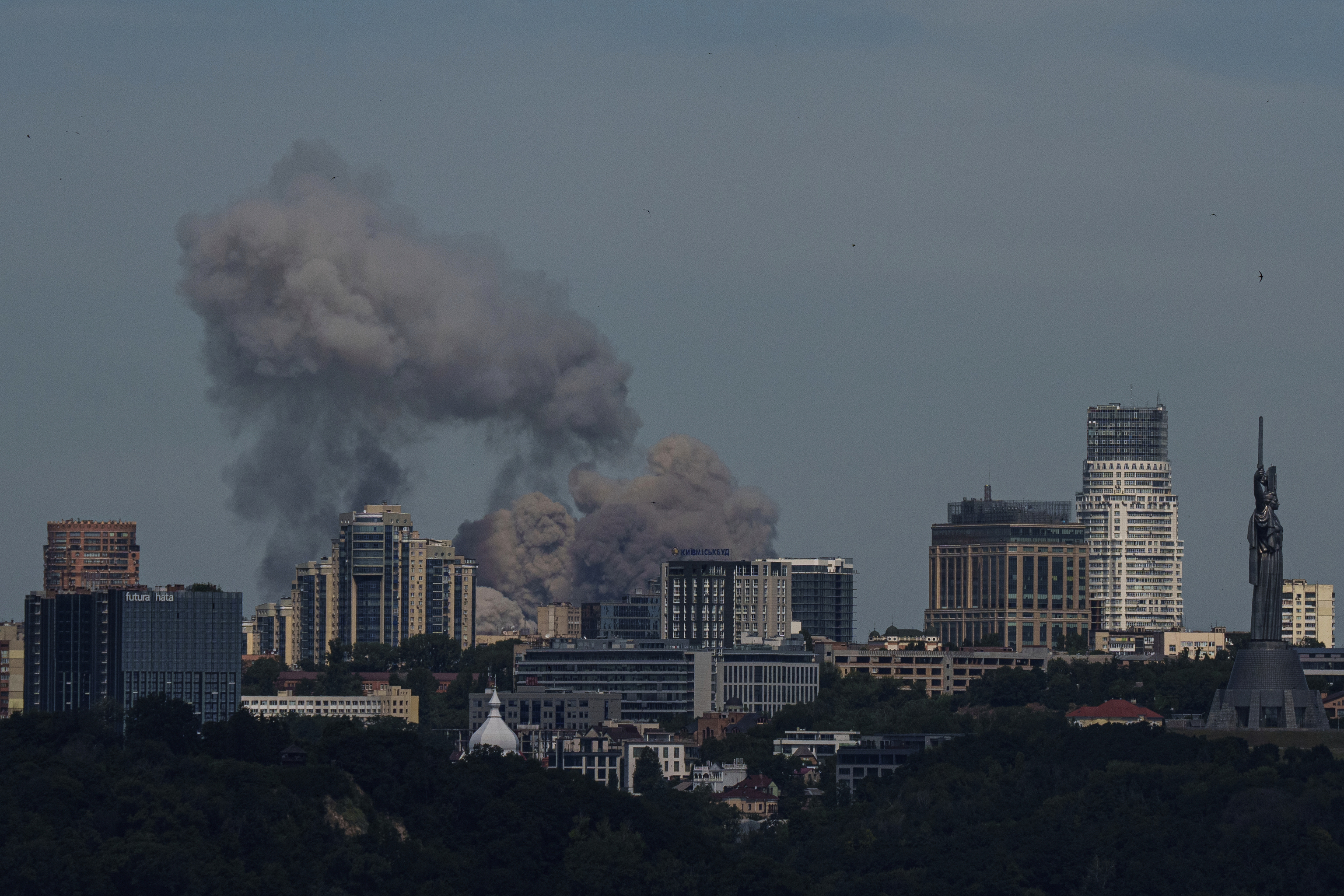 Smoke rises over the Kyiv skyline after a Russian attack