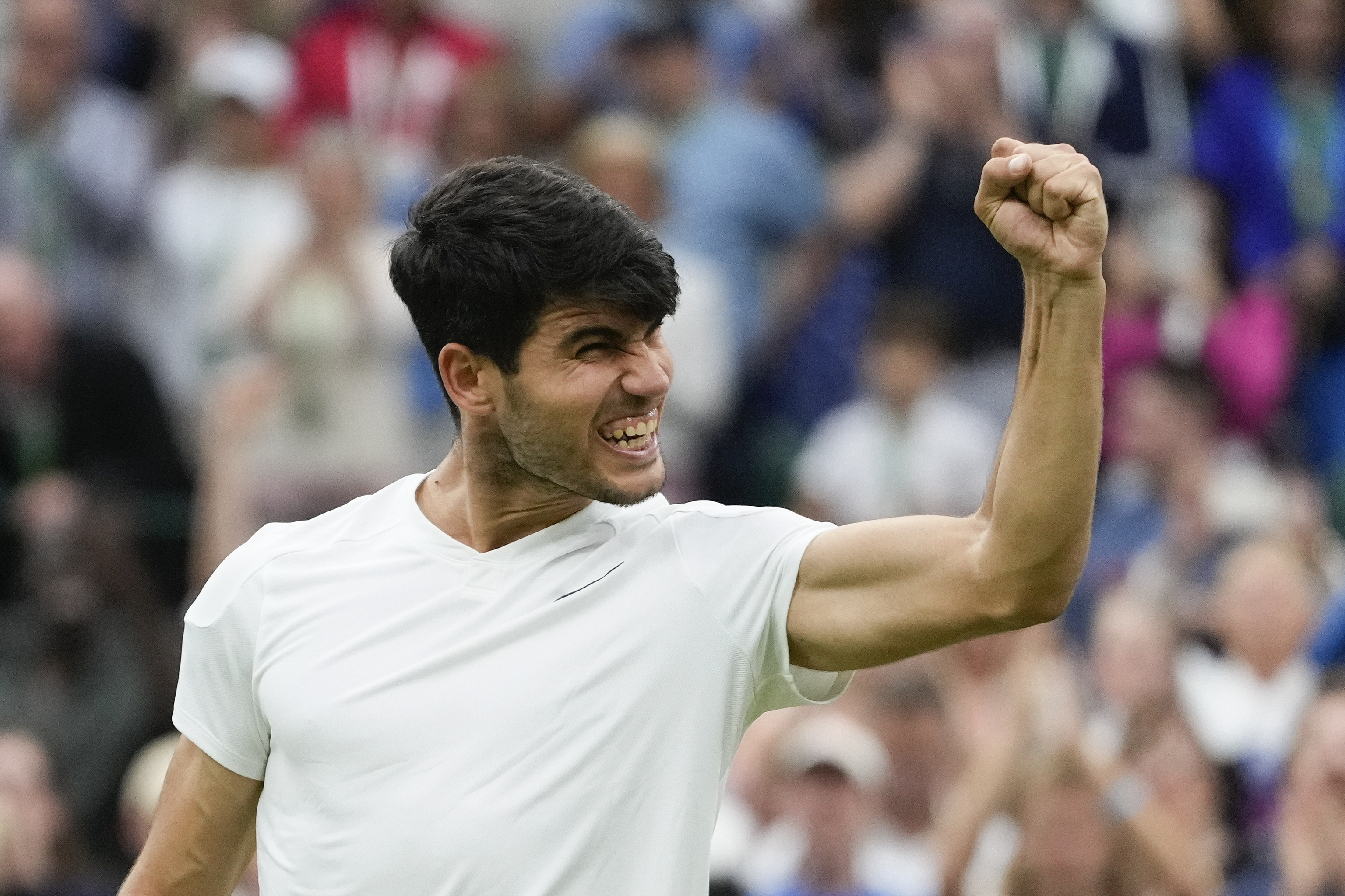 Carlos Alcaraz of Spain celebrates after defeating Tommy Paul of the United States.