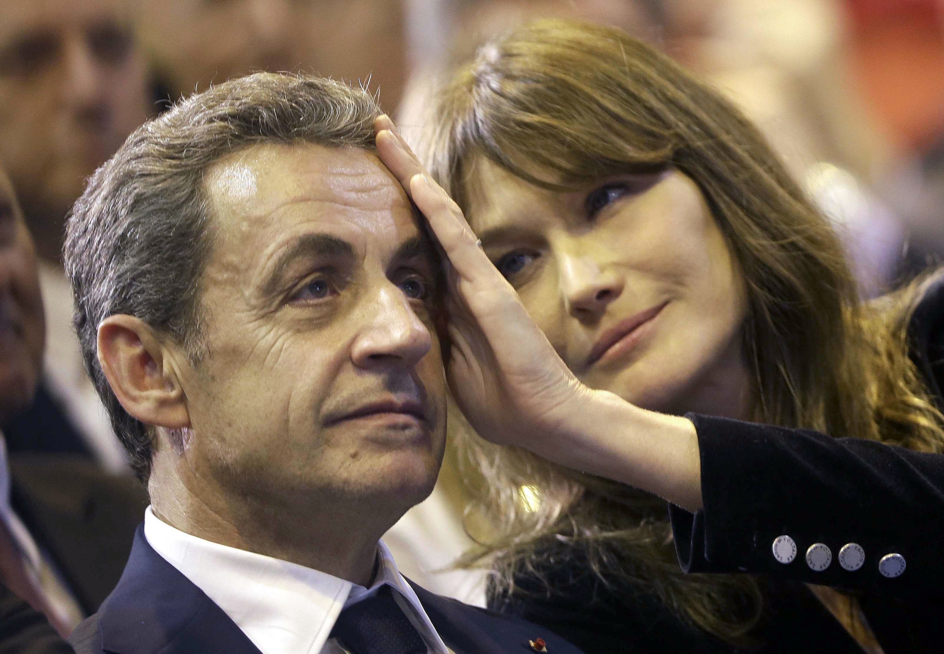 Carla Bruni caresses to her husband Nicolas Sarkozy.