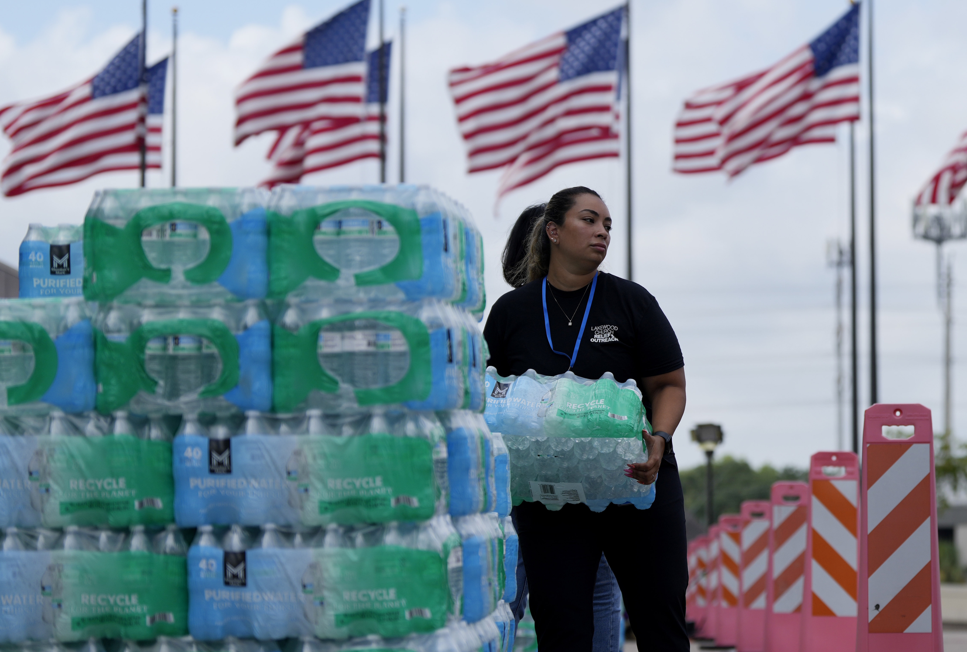 Staff at Lakewood Church hand out water in Houston.