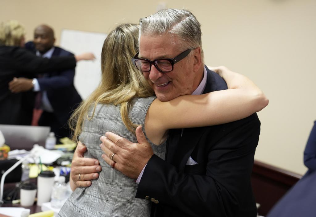 US actor Alec Baldwin hugs a member of his legal team at the conclucion of his trial